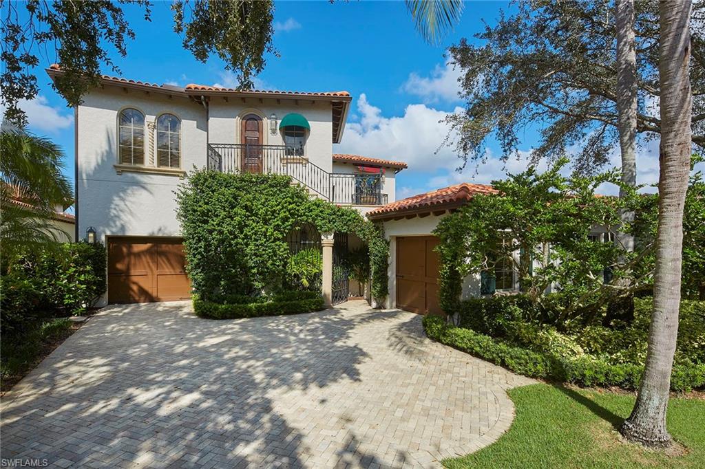 Welcome to this luxurious golf villa located on a private picturesque lake to golf homesite residing in the heart of the exclusive Estuary at Grey Oaks community. This magnificent residence features over 5,100 square feet of living space including 4 bedrooms plus study, 4 full and 2 half baths. The charming courtyard entry includes a stone fountain and an elegant mahogany front door with detailed precast surround. The open layout is flooded with natural light including two separate living spaces both connecting to the spacious remodeled kitchen complete with large island, menu desk, Wolf and Sub-Zero appliances and an adjacent breakfast nook and utility room. Ninety-degree pocketing sliders lead to the screened-in outdoor living space perfect for entertaining including a heated pool and spa and gas grill all overlooking the serene lake and golf course view. Additional features include impact windows and doors, new roof in 2023 and a second-floor bonus room. A world of luxury awaits you within the updated, award-winning Grey Oaks Country Club community minutes from world-class dining and beaches of Old Naples.