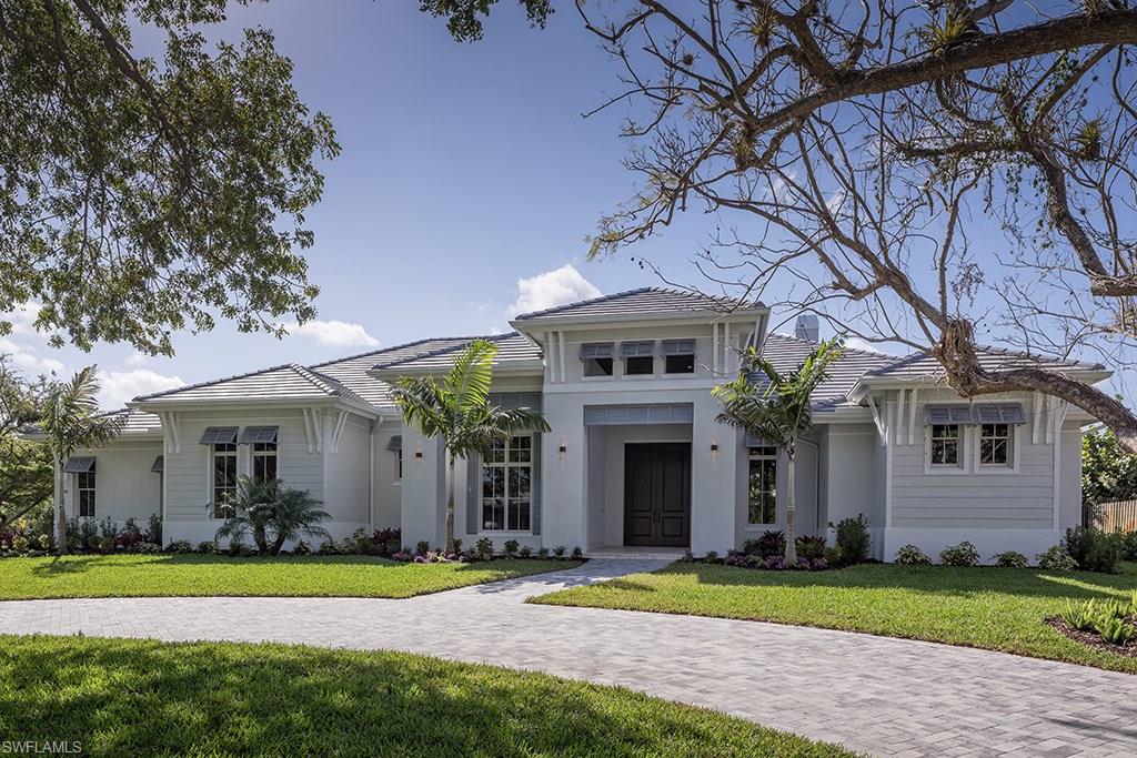 Exciting new construction opportunity with southern exposure, thoughtfully positioned on a large lot at the corner of tree-canopied streets in Coquina Sands. The residence, all situated on one level, with four bedrooms plus a den was inspirationally conceived to address the needs of today’s buyer. Particular attention was paid to great room spaces with abundant light emphasizing indoor-outdoor living and entertaining. The well thought out kitchen with two islands is comprehensively equipped and serves the casual dining area, covered outdoor living area and adjacent great room with ease. Three garage spaces. Conveniently located in Coquina Sands and close to the beaches of Naples and Lowdermilk Park.