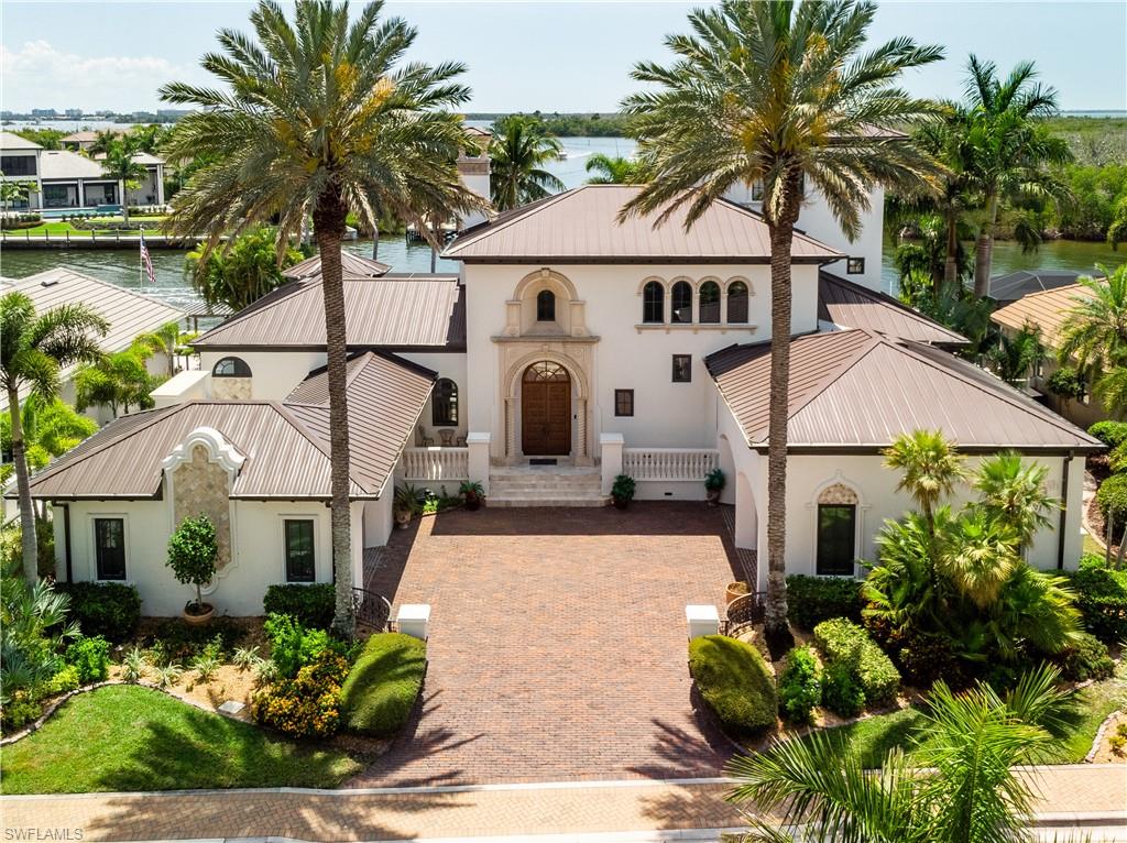 Luxury Waterfront Living in Cape Coral's Exclusive Hermitage Community
Introducing a rare opportunity to own in the gated Hermitage community-a private, luxury waterfront enclave of just 19 residences. Offered for the first time publicly, this exceptional property combines exclusivity, location and a true boating lifestyle, all just steps from Cape Harbour Marina. Spanning nearly 4600 sq ft of air conditions space, the home is perfectly positioned with highly sought-after southern exposure, capturing long canal views that extend to the Caloosahatchee River with direct Gulf access to the Gulf of America. Enjoy a dynamic waterfront setting with boats passing by daily-a true southwest Florida experience. This spacious residence features 4 bedrooms plus a den, 6 bathrooms, an elevator to all 3 levels and over 1050 sq ft of garage space. Every bedroom and the den are ensuite and open to private patio/balcony with water views. Inside, the home offers two expansive living areas and a large, updated kitchen, all designed to maximize natural light and showcase the waterfront backdrop. Seamless indoor-outdoor living is at the forefront with vanishing sliding glass doors off the main living area and kitchen, opening completely to the lanai and bringing the outside in-perfect for entertaining and enjoying the waterfront breeze year-round. The full width lanai is built for resort-style living, featuring a heated saltwater pool & spa with new equipment, summer kitchen with new Napoleon grill, and a double-sided fireplace that enhances both indoor and outdoor living spaces. For boating enthusiasts, the oversized dock is a standout, equipped with three boat lifts plus a kayak/paddleboard lift, offering exceptional capacity and convenience and even deep-water access for your 50+ ft yacht if desired. With world class fishing, dolphins and manatees in your back yard, what's not to love? Additional highlights include a spacious front courtyard and extensive recent upgrades, including a new roof, fresh interior and exterior paint, impact resistant windows and doors, new blinds, A/C units, landscape lighting and new tile inside and out. There is also a buried propane tank for grill, fireplace and pool/spa heater. With only 19 residences, first time availability and a premier waterfront location, this is a truly rare offering in one of Cape Coral's most exclusive luxury communities. Call your agent, pack your bags and make 1526 Hermitage Lane your new Cape Coral address today.
