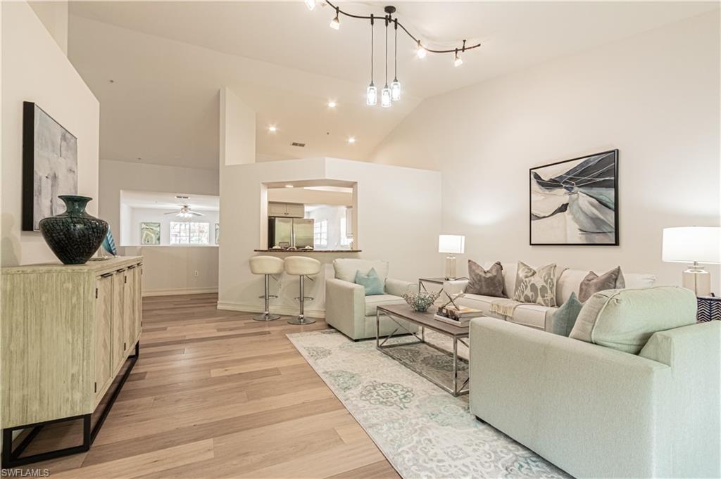 Here's your perfect piece of paradise. This 2nd Floor Condo features 2 Bedrooms + a spacious open Den, 2 Full bathrooms, separate dining area, vaulted ceilings and attached 1 Car Garage. The open and split bedroom floor plan features Immaculate English White Oak wood flooring in all main living areas, tiled bathrooms, laundry and lanai. The Granite Kitchen is equipped with stainless steel appliances and a pantry.  This condo is tucked away in the lovely Gated community of Briarwood which FEATURES two swimming pools, tennis courts, pickleball, basketball, volleyball, a children's playground and much MORE!! Centrally located and CLOSE to 75, 5th Ave, Mercato, Naples beaches, Dining, Shopping and much MORE! You do not want to miss it.