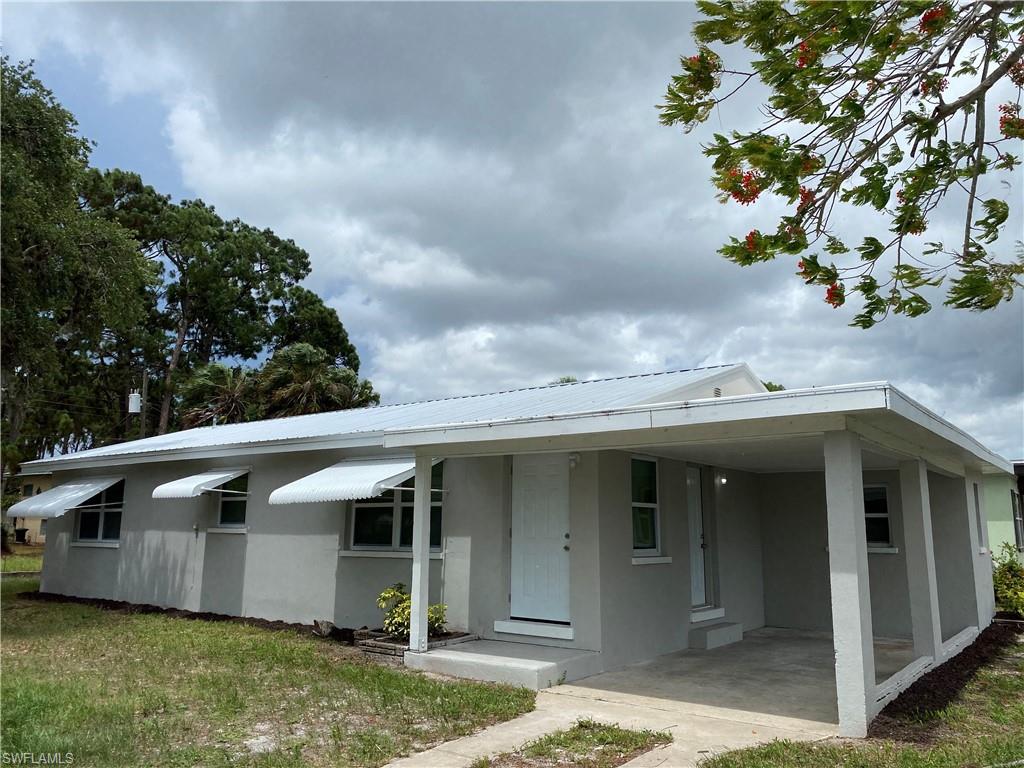 Newly renovated block home with metal roof.  Freshly painted inside out with a tiled shower tub, granite countertops, and stainless steel appliances. This home has 3 bedrooms with a den as big as the bedrooms.  3 brand new A/C window units come with home!  Master has a half bath and a sizable closet.  The attached covered carport will allow for easy access to the home.