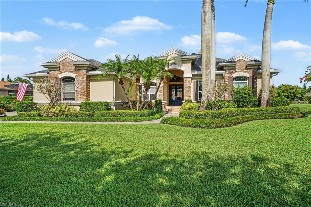 Experience lakefront living in Blackhawk, one of South Fort Myers' most exclusive gated communities featuring just 78 custom estate homes. Residents enjoy oversized homesites, mature landscaping, and a serene setting. Situated on a picturesque .67-acre homesite with tranquil water views, this beautifully updated custom residence offers over 3,700 square feet of thoughtfully designed living space, featuring 4 bedrooms, 3.5 baths, an office, and a versatile media room.
At the heart of the home is the renovated kitchen, updated in 2015, showcasing timeless finishes and seamless flow into the main living areas. A fireplace creates a warm focal point, while expansive windows and sliding glass doors frame the lake views and fill the home with natural light.
Enjoy your own Florida retreat, where a panoramic picture-screen lanai overlooks the resort-style pool, spa, and peaceful waterfront setting. The exceptional outdoor living space features an expansive travertine pool deck and panoramic screen enclosure completed in 2020, along with an outdoor kitchen (2015) and outdoor shower—creating the perfect setting for relaxation, entertaining, and embracing the Southwest Florida lifestyle.
Ideally located just minutes from premier shopping, dining, championship golf, Southwest Florida beaches, RSW International Airport, and spring training venues, this exceptional property offers both privacy and convenience in one of Fort Myers' most sought-after communities.