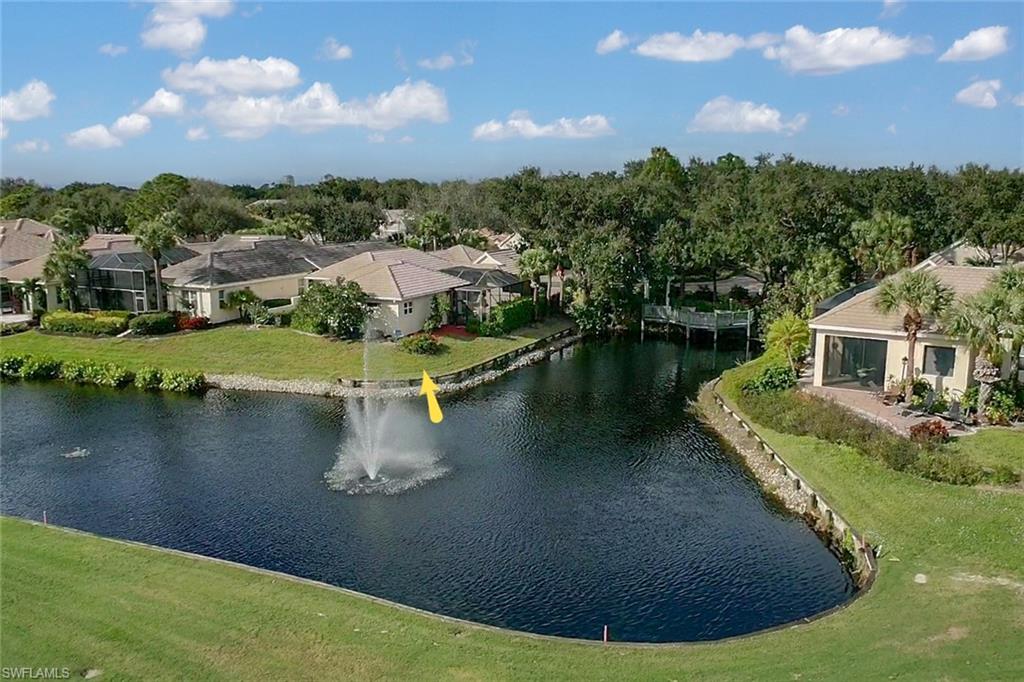 Stunning lakefront setting! This single family home is situated in the amazing community of Cottages of Pelican Landing-  coastal community offering lake & golf course views. Meticulously cared for courtyard home offering a great room design, spacious kitchen w/ breakfast nook & induction oven/range, formal dining area, large tile flooring in main living area, custom built in entertainment center, spacious master suite, full detached guest cottage, den/home office, 2-car garage, and stunning courtyard w/ pool & spa. This area of Pelican Landing is highly desirable & hard to find. Pelican Landing offers a wonderful coastal community w/ tennis, golf, beachfront, community center, and community event calendar.