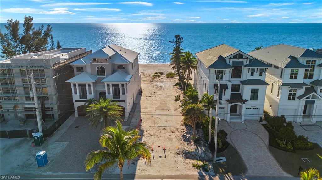 Opportunity awaits! This lot is a blank slate, ready for you to imagine your private beach retreat. Offering a generous buildable area, a home on this site could likely exceed 5,300 square feet of living space. Renderings and plans are available with award-winning Potter Homes to help your dream become reality. Centrally located - Bonita Beach is 30 minutes from all three airports, 15-20 minutes to the Waterside Shops, Mercato, Coconut Point, and mere steps to white sand and stunning sunsets. This is your opportunity to build the life you've always wanted and make memories with those that matter most.
