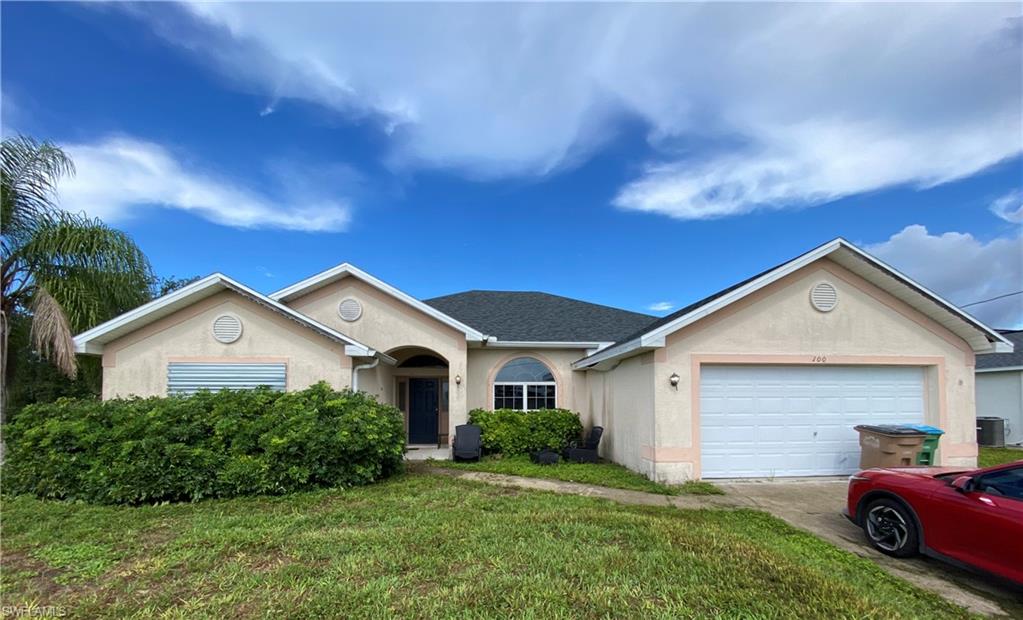 A great opportunity in highly desirable Northwest Cape Coral! Situated on an expansive 0.35-acre triple lot, this 4-bedroom, 2-bathroom home offers 2,331 square feet of versatile living space. Recent upgrades include a new roof installed in August 2023, and the HVAC system was installed in August 2019. The interior features tile and laminate flooring, a split-bedroom floor plan, a formal living room, kitchen, dining area, great room, and an interior laundry room. There is also an attached 2-car garage and lanai. The kitchen has stainless steel appliances and plenty of cabinet space. With a fresh coat of interior/exterior paint and some personalized landscaping updates, this property will easily transform into your dream home. The triple lot provides a completely blank canvas with endless possibilities—perfect for adding a custom pool. Don't miss out on this incredible value in a fast-growing neighborhood close to parks, schools, boat ramps, and local dining! Schedule your private showing today.