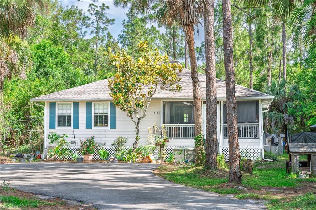 Adorable 2 bedroom cottage on 1.14 private acres in Golden Gate Estates, and priced to sell! Kick back on the screened front porch and soak up the quiet, the kind of peaceful setting that's getting harder to find. Inside, the spacious family room opens up under a vaulted ceiling that keeps the whole home feeling bright and airy. The kitchen is a real standout, with granite countertops and a designer backsplash framing an open layout that keeps you part of the conversation while you cook.

The best part is the land. Over an acre to call your own means room for the cars, the boat, the RV, and all the toys, with plenty left to spare. Want to add a workshop, a pole barn, a pool, or a big garden? There's space for it, and with no HOA, this property is yours to make your own. You get true country quiet out here, yet you're only a short drive from Naples beaches, downtown, shopping, dining, and I-75.

A cottage with this much room to roam, at this price, won't sit long. Come take a look before someone else calls it home!