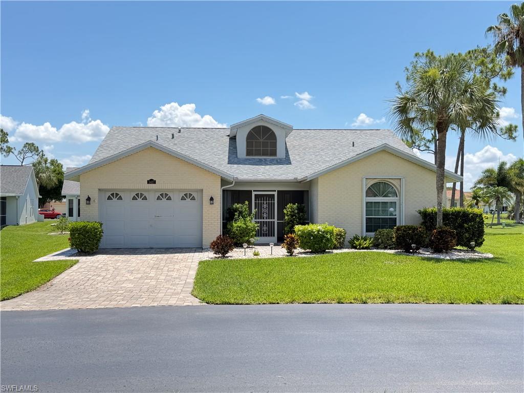 Welcome to Sabal Springs Golf & Racquet Club.  Great Room Open Concept home with 2 Bedroom, 2 Bath and a split floor plan.  Located in the heart of the community just steps to the Clubhouse.  Amenity-rich, vibrant, 55+ resort style community.  Double door entry from screened lanai/porch where you can enjoy those stunning Florida sunsets.  Great room has beautiful neutral tile done on diagonal with vaulted ceilings.  

Roof 2023.  Energy efficient (double pane) windows that aid with insulation and soundproofing throughout home.  Lightning surge protectors for whole house.  Spacious kitchen with plenty of cabinets and a breakfast/nook area.  Separate dining area.  Primary suite with vanity, shower and walk in closet.  Inside laundry room with washer, dryer, utility sink and cabinets.  The large Florida room provides valuable additional living space with retractable shade awnings.  Catch a view of the sunrise over the lake while enjoying your morning coffee.  Great added value to your investment with a Whole House Generac Generator to protect your home and will give you peace of mind.  Hurricane Shutters.  

Abundance of amenities include a resort style heated pool with hot tub/spa, on-site resident owned restaurant, golf course, putting green, fitness room, event/ballroom, billiards/game room, library, tennis and pickleball.  A full calendar of social activities to your choosing.  

Maintenance fee is $385/month paid quarterly includes cable/internet, basic lawn care, irrigation, pest control, fertilization and house painting every 7 years.  Not in a Flood Zone.  Conveniently located to Ft Myers River District, airport, VA clinic, hospitals, dining, shopping, churches and other attractions.