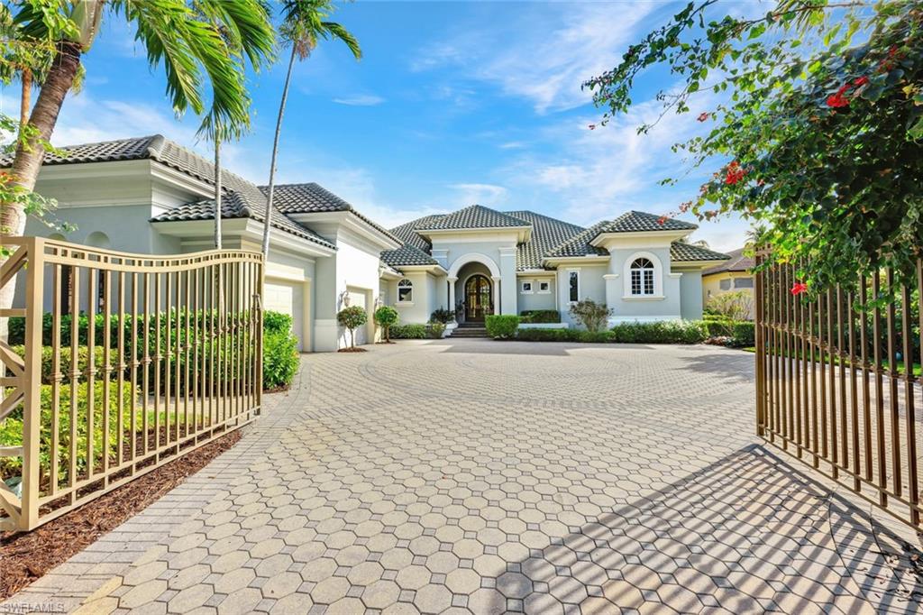 THIS IS IT! The only home of eleven available in coveted MARINA POINTE at BONITA BAY! Collins Dupont custom designed estate home boasts over 5600 sq ft of living, 5 ensuites to include a separate cabana, 7 baths, study, & spacious 3 car garage. Entertaining is limitless. Jump in your boat on the Imperial River for a quick ride out to the Gulf of Mexico, return home & splash into a massive oasis style pool/spa & outdoor area. Family & friends will enjoy grilling & libations by the outdoor kitchen & bar or head over to Backwater Jacks for a lively meal, eventually retiring to beautifully appointed guest rooms or pool cabana. You will appreciate the tranquil & distinct setting of the owners suite that provides his & her bathrooms & oversized custom closets.  The chefs kitchen & large island opens to the living & dining area with a separate bar for continued indoor entertainment. There is plenty of parking within the private wall & gate to the home & provides a well designed oversized 3 car garage. Bonita Bay has an abundance of amenities, 5 golf courses, tennis, pickleball, health & fitness center, private beach club, clubhouse, restaurants, marina and much more.