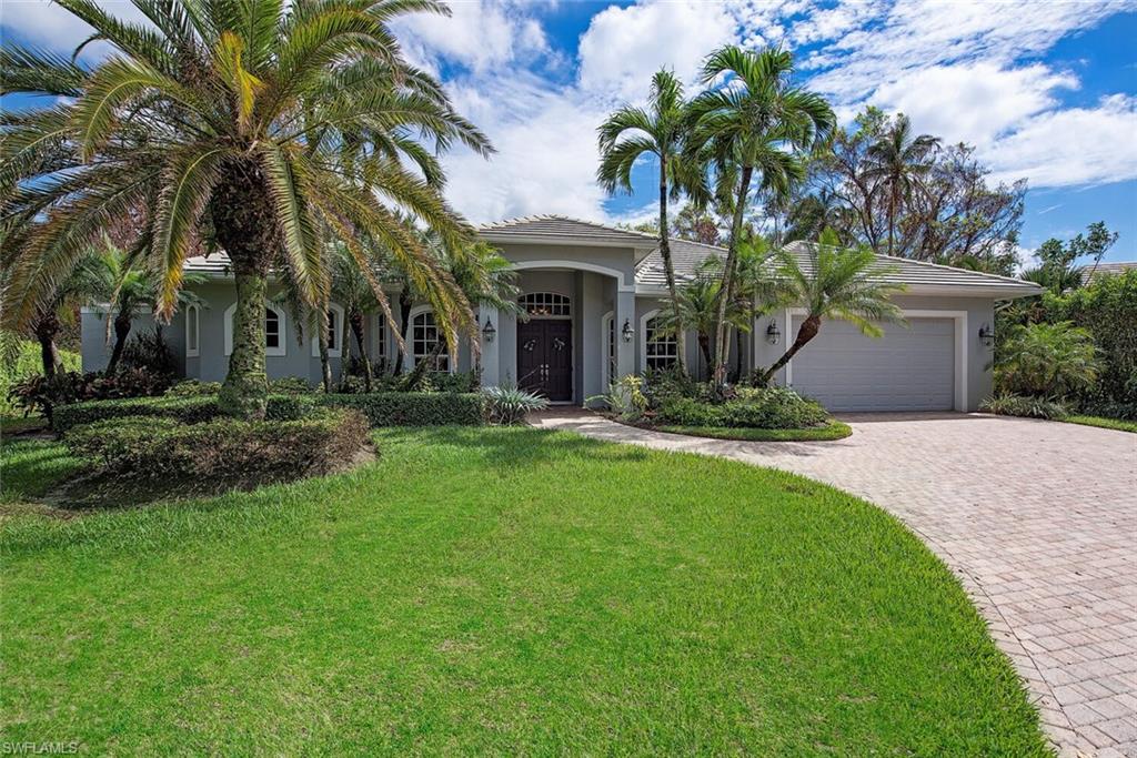 This gorgeous single level home was purposefully built at a higher than normal elevation in 2002. Conveniently located in Park Shore and move-in ready! Being sold partially furnished, you can call it home almost immediately. Built with quality in mind, this home features soaring ceilings, newly renovated kitchen, breakfast nook overlooking the pool and gardens, formal dining room, and three large bedrooms as well as a fourth currently being used as an office! The master suite features tall ceilings, dual walk-in closets plus an owner's closet, and a master bathroom with dual sinks, walk-in double shower, jetted tub, and private patio with optional outdoor shower. The thoughtful floor plan features split bedrooms and a modern open layout. The twelve foot sliding glass doors in the spacious living room open out to the covered lanai and sparkling pool/spa.  The cul-de-sac setting offers low traffic and the location is within easy walking distance to Waterside shops, Clam Pass, and Seagate Beaches, and Sea Gate Elementary School. Park Shore residents can have access to a private park area with restrooms, picnic areas, and of course beautiful white sandy beach. This is a MUST SEE home!