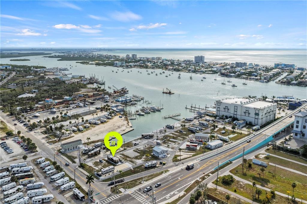 Location, location, location! Fort Myers Beach is just a walk over the bridge. RV to convey with a total asking price of $175,000. This lot is located in Gulf Cove, a co-op community. This means you own 1/60th of the community. It is a 55+ waterfront community, the Board of Directors is working on a process for the boat slip assignments. Low HOA fees, only $800/quarter! Sewer, water, and electric for the community has been completed, and an electric power pedestal has just been installed for the lot. Highway ready RVs currently allowed on the lot through October 2027. Large lot with a fresh concrete pad allows enough space to accommodate a double wide trailer. New homes must be built to FEMA standards 8-10 feet above ground. Water, sewer, and electric available. Discover your new piece of paradise today!