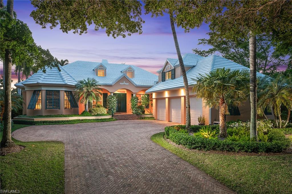Rarely available Bermuda-style home in the gated enclave of Little Harbour. Spectacular setting for this warm, inviting home. Enjoy glorious sunsets from the spacious lanai and pool area overlooking the lake and fountain. There are four bedrooms and a den/office and 4.5 baths. The floor plan offers the ultimate privacy with two of the bedrooms in a separate guest house overlooking the pool. High ceilings throughout with many windows bringing in lots of light. The kitchen is a gourmet Clive Christian design with Italian Dolomite marble counters. Primary bedroom wing features a large bedroom, two walk-in closets, dual vanities, separate Jacuzzi tub and tile shower. The screened porch overlooks the lanai and pool area. Little Harbour has nine boat docks with access to Naples Bay and the gulf. They can be leased on an annual basis, being repaired now post-Ian. Three-car garage with tile flooring. New roof installed in 2023. The property is eligible for Port Royal Club associate membership.