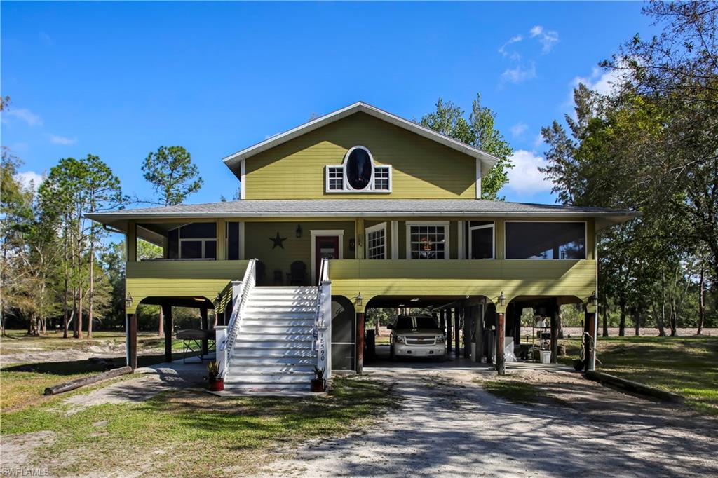 HUGE PRICE DECREASE!!  At the end of a 1000ft gated driveway you will find this amazing Old Florida Style home with a 1400sqft full wrap around porch situated on a very remote 5 acres! This house boasts an astonishing 5900sqft in useable space! Underneath the home, you'll find 2500sqft of space including an enclosed patio with a jacuzzi and separate exercise room. Once you enter the home you'll find custom hardwood floors greet you throughout, a gourmet kitchen with wood cabinets, granite counters, & upgraded stainless steel appliances. From the kitchen sink enjoy almost 180 degrees of breathtaking views. Also on the first floor you will find the dining, living, master bedroom and full bath. At the top level of this amazing home you will find another 900ft of living space with two bedrooms, full bath and a second rec/living room. Also on this property there is another metered pole for electric service near a separate septic and well, add a mother in law suite, trailer, or rental spot. Along the property line a shooting range is situated for safe shooting & pleasure. Lots of Shade and old Florida charm on this amazing one of a kind property! CLICK VIRTUAL TOUR FOR 3D VIEWING!
