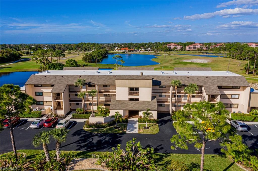 Water views will wow you the moment you step inside! Overlooking a large golf course pond, you’ll have a front row seat to watch golfers and wildlife from your large screened lanai. Inside is a COMPLETELY remodeled 2 bed/2 bath TURNKEY FURNISHED condo!  A light and bright kitchen features new soft-close cabinets, granite counters, subway tile backsplash, stainless appliances and LED under cabinet lighting. Accents include crown moulding in the main living area, 6 inch baseboards and framing around the sliders. Split layout for privacy and spacious bedrooms. The master bedroom features views of the water and a new door out to the lanai. The stunning ensuite master bath was just completed with a new walk-in shower, dual vanity with quartz top, tile plank flooring, new mirrors, fixtures and new soft-close cabinets. The guest bath features a new vanity with granite counter and hardwood cabinet and matching mirror. New diagonal tile flooring in kitchen, dining and baths and new carpet in bedrooms and great room. Full-size washer and dryer and lots of closet space. And new hurricane-rated sliding doors AND windows throughout. Ground floor means no stairs or waiting for the elevator!