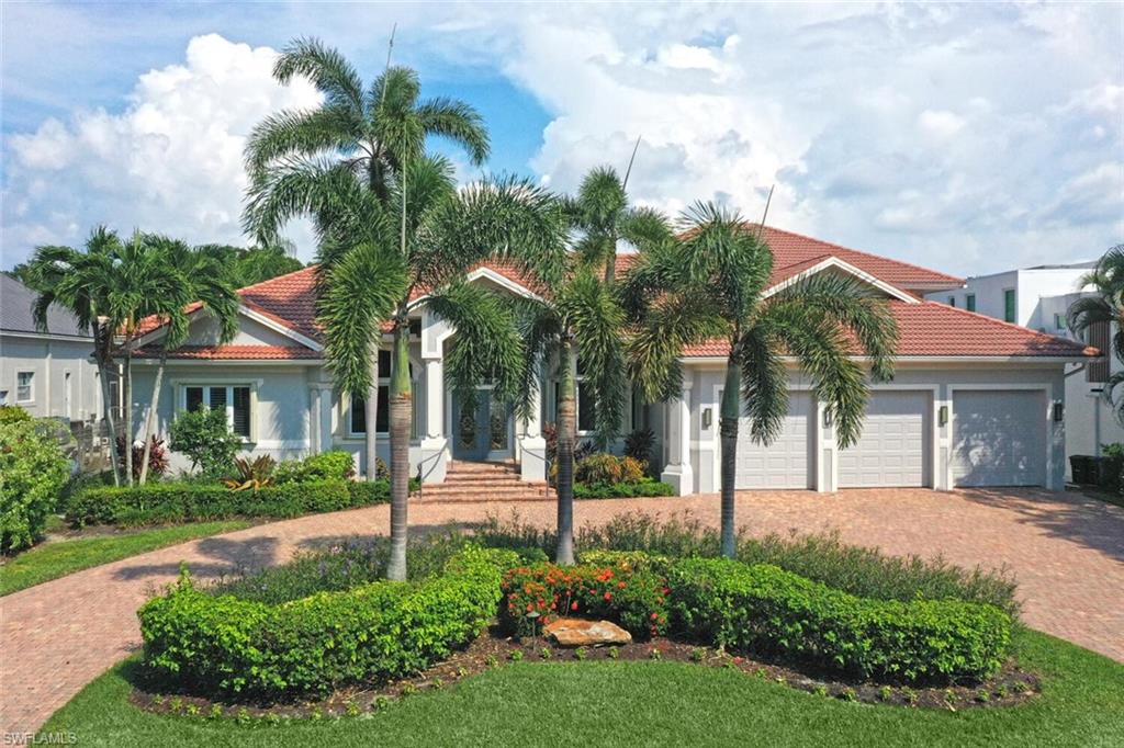 PRICED TO SELL! This stunning 4-bedroom + den, 3.5-bathroom pool home with a 3-car garage and desirable Eastern exposure offers a prime waterfront lifestyle. Perfectly designed for both indoor and outdoor entertaining, this spacious residence features an open and captivating floor plan. The master suite and two additional bedrooms are conveniently located on the main floor, while the second level includes a private suite with a walk-in closet, full bath, its own living area, and a bonus flex room. The newly remodeled kitchen and bathrooms, paired with luxury vinyl oak flooring throughout, bring a touch of modern elegance to this charming home. The garage is equipped with an EV charger, catering to your electric vehicle needs.  Nestled in Seagate, one of Naples' best-kept secrets, walk to the beach in this exclusive beach and boating community,  Easy canal access for small boats, kayaks, and jet skis via Clam Pass. Located just minutes from premier shopping and dining at Mercato, Waterside Shops, and Venetian Village, this home truly embodies the best of Naples living.  Families will love the walkability to Seagate Elementary School, while residents can enjoy optional membership at the private Seagate Beach Club, featuring gated entry to a secluded beach area within a fenced, private community setting.  No flooding inside the home during any any of the storms, including Ian.