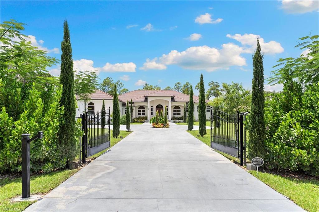 Welcome to an extraordinary custom-built estate where luxury, comfort, and peace of mind come together on 2.5 private acres in Golden Gate Estates. Offered completely turnkey furnished with high-end furnishings and designer finishes, this exceptional residence is truly move-in ready—just bring your suitcase.
Designed with both everyday living and entertaining in mind, the spacious floor plan features 4 bedrooms, a den, 3 full bathrooms, an expansive great room, and a luxurious owner's suite with a spa-inspired bath and oversized walk-in shower. With 4,279 square feet under air and 5,672 total square feet, there's room for everyone to spread out and enjoy.
The outdoor living space is just as impressive. Relax year-round on the screened lanai featuring a heated pool and spa, all surrounded by the privacy and tranquility of your beautifully landscaped 2.5-acre property.
Built with quality, craftsmanship, and durability in mind, this home showcases premium upgrades throughout, including impact-resistant windows and doors, a whole-house reverse osmosis system with a 500-gallon storage tank, a whole-house generator with a Starlink internet backup system, a radon mitigation system, a safe room, superior insulation, two-zone A/C, security cameras, remote monitoring for water, smoke, and carbon monoxide, child safety door sensors, automatic irrigation, and an oversized 3-car garage.
The chef's kitchen is beautifully appointed with quartz countertops, premium LG appliances, and an oversized California Closet pantry.
Special features include:
• Whole-house generator with Starlink internet backup system
• Heated pool and spa
• Radon mitigation system
• Impact-resistant windows and doors
• Whole-house reverse osmosis system with 500-gallon storage tank
• Safe room
• Two-zone A/C
• Security cameras with remote monitoring for water, smoke, and carbon monoxide
• Automatic irrigation system
• Oversized 3-car garage
• Turnkey furnished with high-end designer furnishings
Every detail of this home reflects thoughtful design, exceptional craftsmanship, and a commitment to quality, offering the perfect balance of luxury, functionality, and peace of mind.
Conveniently located near the newly opened Vanderbilt Beach Road Extension, with future plans to extend the corridor east to Everglades Boulevard, this property provides easy access while preserving the privacy and serenity that make Golden Gate Estates so desirable. Just a short drive from Naples' world-famous white sand beaches, championship golf, fine dining, shopping, and entertainment, this remarkable estate truly offers the best of Southwest Florida living.