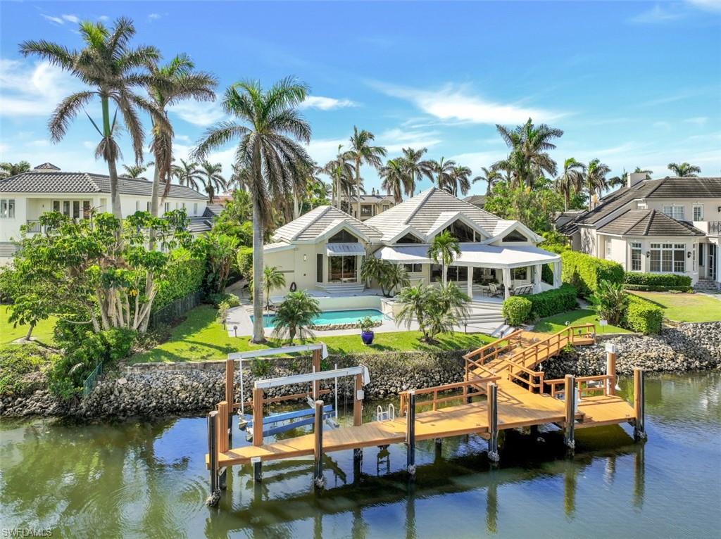 Waterfront Jewel SOLD AT LOT VALUE “As Is”
Boaters Dream, short walk to The port Royal Club for dining, tennis, workout and the pristine beach.  Your Home has been professionally reappointed in Nov. 2022. Upon entering this open floor-plan with soaring  ceilings, clean lines. the large living room/dining room with wet-bar is framed by glass windows and doors which expands out to a large lanai, w/electric shutters, overlooking, Runaway Bay. The spacious open  gourmet kitchen with breakfast room has an expansive center island, multitude of cabinets, with great views of the bay. The first floor master suite has his and hers, oversize custom design closets, walk-in shower, soaker tub, bidet, separate commode,  and fabulous water views. All 3 guest rooms, have large closets, private baths, and two have private sitting porches. Large heated swimming pool with hot tub overlooking the bay. It’s a boaters paradise allowing for up to a 60 foot yacht, extra  boat-lift that will accommodate a 32 foot boat, and added space for either kayaks, paddle boards or JetSki‘s. It’s a short walk to the beach and  The Port Royal Club. This home is Port Royal Club eligible.