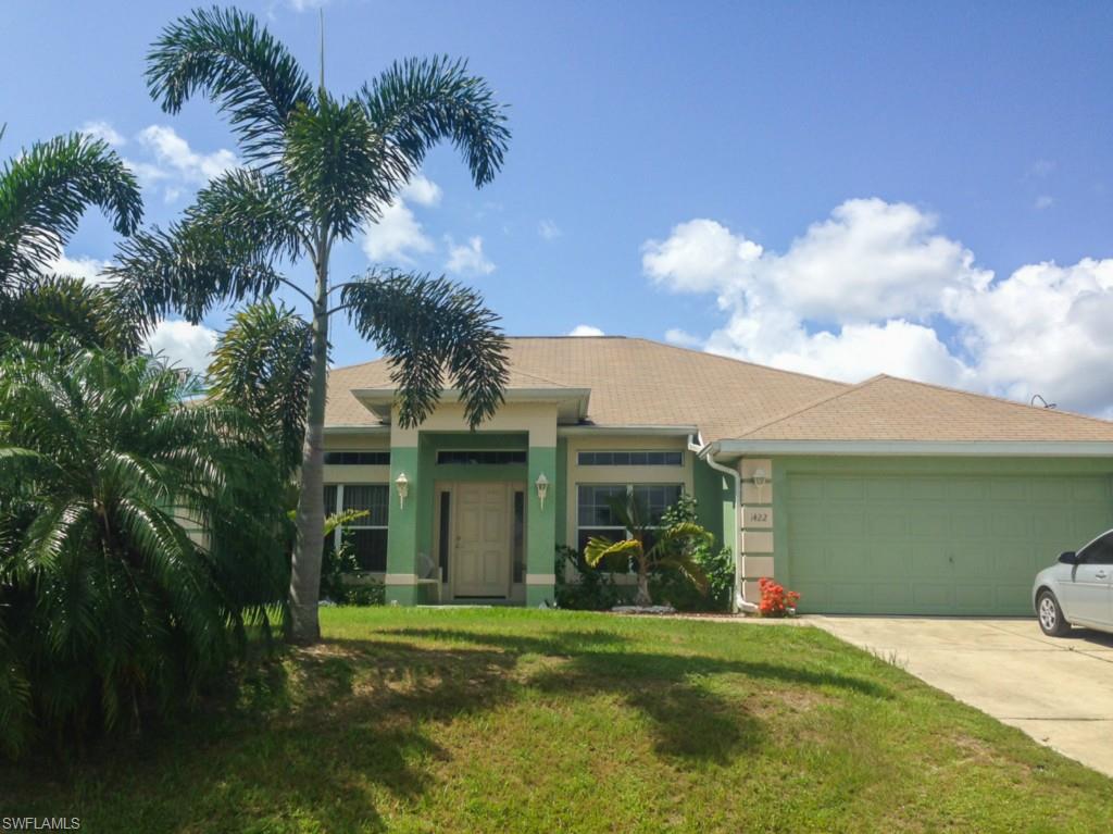 Built in 2006, this spacious home in SW Cape Coral 4 bedroom / 2 bath pool home. Offers a great room layout with majestic cathedral ceilings that makes the 2100+ square feet of living area feel like even more. Separate dining and breakfast areas are great for entertaining and creating all of those precious moments that will stay with you always. The relaxing pool features pavered pool deck area and protective fence. This home also offers an indoor laundry room, walk in his and hers closets, A master bathroom with dual vanities, plus separate tub and shower. This one will not last for long...bring your offers TODAY!!!