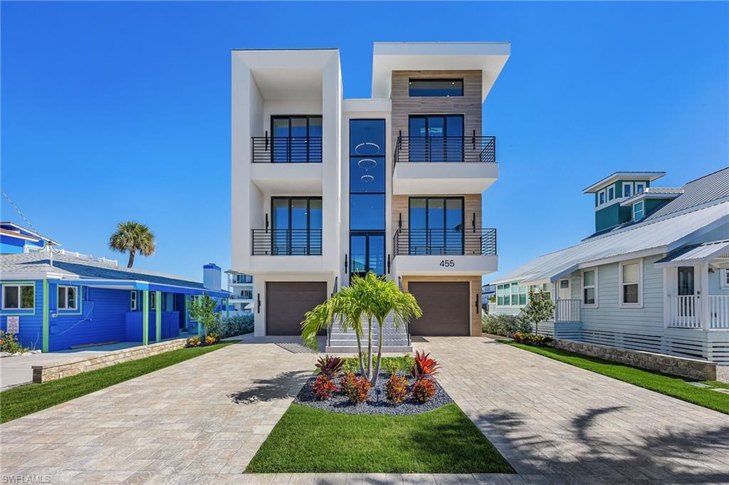 Distinguished architectural new construction canal-front pool residence located on Palermo Circle, one of the most coveted streets on the north end of Fort Myers Beach. Primarily concrete construction, this refined contemporary home showcases bold architectural lines and elevated finishes, offering a seamless blend of sophistication, comfort, and coastal design.

Designed for both entertaining and everyday living, the home features six bedrooms and six baths, including two expansive primary suites, within light-filled open-concept living spaces. The designer kitchen serves as a focal point with premium appliances, while the walk-in pantry is thoughtfully appointed with a standalone ice maker for added convenience. A dramatic floating metal staircase anchors the interior, complemented by a private elevator providing access to all levels.

Both primary suites offer private retreats with tranquil water views, custom detailing, and spa-inspired baths. One suite is further enhanced by breathtaking bay views, creating an exceptional owner’s sanctuary.

Outdoor living is elevated with a private heated pool and spa, multiple balconies, and sweeping canal and bay views, with select sightlines extending toward the Gulf of Mexico.

Entry is through the garage into a welcoming foyer with direct access to the stairway and elevator. Parking accommodates up to six vehicles, including two garage spaces. Ideally located within walking distance to the beach, pier, shopping, dining, Margaritaville Resort, and the Times Square district, this exceptional residence delivers a premier luxury island lifestyle.
