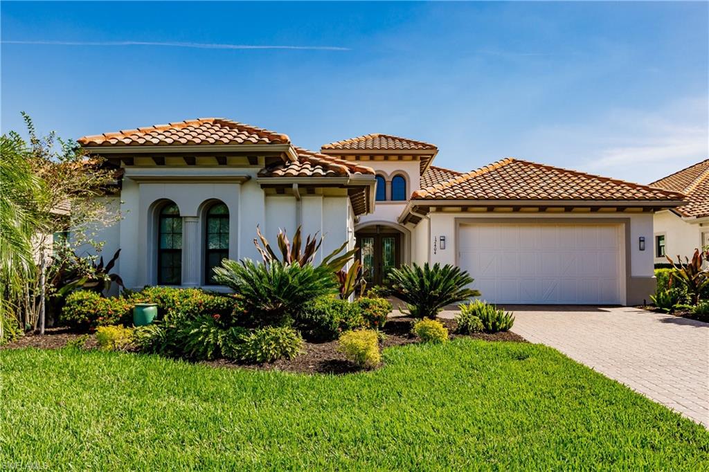 SPECTACULAR HOME WITH FULL GOLF MEMBERSHIP INCLUDED WITH PURCHASE! This exceptional residence has a magnificent lake and golf course view with 2,618 sq. ft. of living area.  It features a great room floor plan with 2 bedrooms, den, 2 1/2 baths, 3 car garage, and is sold turnkey including furniture and decorations throughout. With a total area of 3,236 sq. ft., this home opens to a spacious outdoor living area with pool & spa, separate seating areas, full outdoor kitchen, modern linear built in gas fireplace, and picture window screens resulting in the perfect tropical paradise for relaxing or social occasions. The kitchen has upgraded cabinets with stainless-steel built-in appliances and is open to the great room creating a perfect setting for entertaining. Numerous upgrades include tray ceilings, upgraded trim package, crown molding & wood flooring throughout, custom lighting and fans, impact windows and electric roll down shutters, Sonos sound system, and security alarm. TwinEagles is a private 36-hole golf community and approved a $22,500,000 Clubhouse and Golf Course renovation that has been RECENTLY COMPLETED, creating one of the finest communities in Southwest Florida.