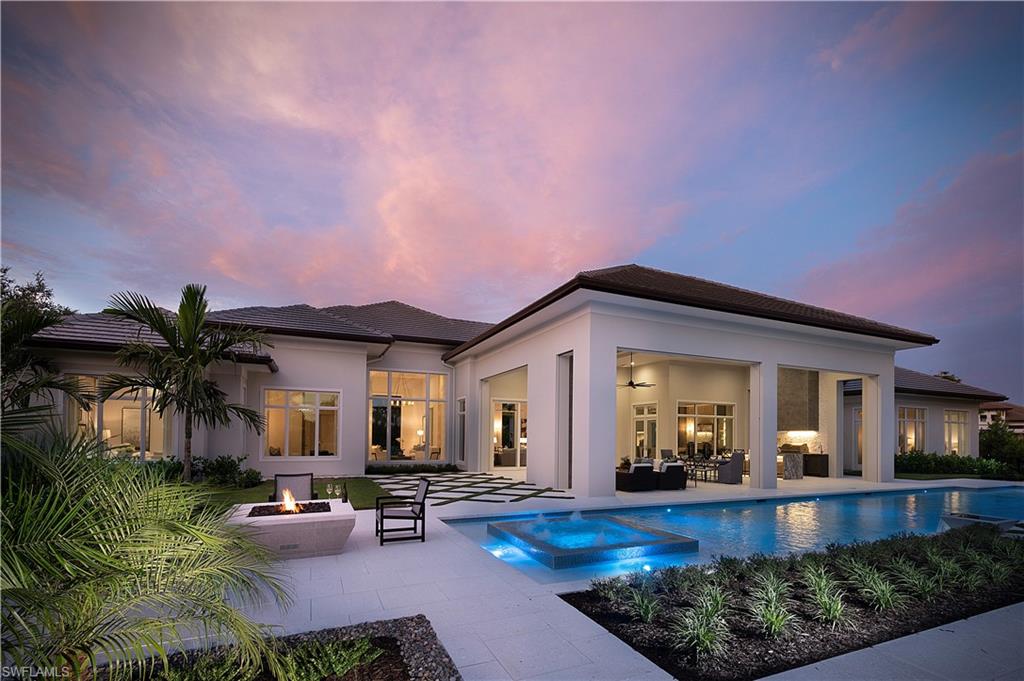 The Streamsong by Seagate Development Group with interiors by Theory Design features 5,295 square feet under air and a 1,191 square foot outdoor living area.  The exterior of the home includes a covered entry sequence lined by columns and a series of planters.  Double doors open to a foyer and a grand reception room adjacent to the great room.  The great room opens to a covered lanai with a fireplace, an island kitchen, and conversation and dining areas.  Inside, the great room anchors a space that includes a dining area and a double-island kitchen.  A hallway overlooking a garden courtyard leads from the living area to a club room and three guest suites, each of which has a full bath and one of which opens to the outdoor living area.  A study/office is located at the opposite end of the hallway, just outside an owner’s suite that includes a vestibule, a bedroom that opens to the outdoors, two walk-in closets, and a bath with his and her water closets, his and her vanities, a free-standing tub, and a walk-in shower.  This home is stunning!  Home is open daily 11:00AM-4:00PM.