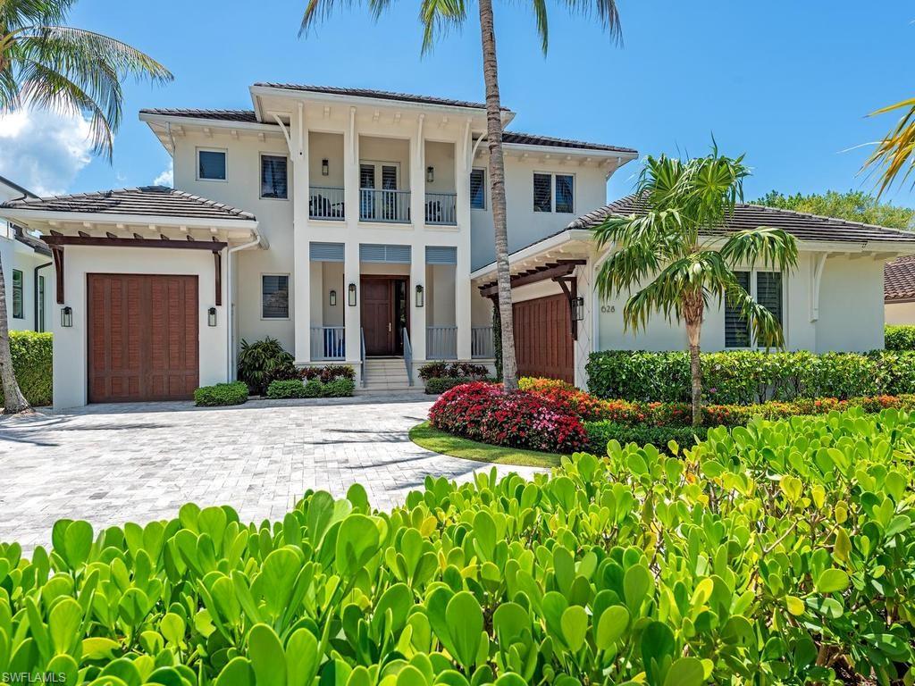 Nestled in prestigious Aqualane Shores, this exceptional waterfront residence offers refined coastal elegance paired with effortless Gulf access—all while remaining high and dry, with no history of water intrusion into the house. Designed by the renowned architectural firm MHK, the home blends timeless coastal sophistication with relaxed West Indies influences, creating an inviting and luxurious retreat.

Boasting five spacious bedrooms, four full bathrooms, two half baths, and office; the home offers an ideal layout for both everyday living and entertaining. Inside, you'll find exquisite white pine and French oak flooring complemented by elegant marble accents, along with custom cabinetry that adds both style and functionality.

The chef’s kitchen is truly a showpiece—featuring premium gas Miele appliances, a double oven, and a wine room—perfect for hosting and culinary enthusiasts.

Seamlessly transition to outdoor living where a heated pool and spa, fully equipped outdoor kitchen, expansive patio, and serene sunroom provide the perfect setting to relax and entertain while enjoying tranquil water views.

Boating enthusiasts will appreciate the state-of-the-art dock, complete with a 20,000-pound boat lift, offering direct canal access to the Gulf of Mexico for the ultimate Southwest Florida lifestyle.

This is waterfront luxury living at its finest—where design, comfort, and location come together in perfect harmony.