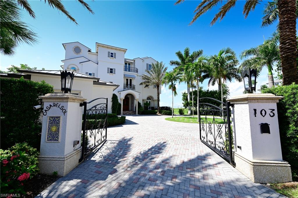 The ultimate beachfront estate property is now available for purchase! This private 3-story Barefoot Beach home sits on a nearly one half acre of gated beachfront & offers no adjacent houses to the north or south. Spectacular Gulf views from Naples to Sanibel. Recently renovated/updated with new metal roof, impact windows & doors, & complete exterior paint, plus interior renovations by Collins & Dupont Design Group. 70' wide floor to ceiling glass sliders on the Gulf of Mexico that continue & wrap around to the north & south. State of the art modern kitchen & bar area, multiple seating areas in the grand room with wide linear fireplace, & den/office/additional sleeping area, all of which offer sweeping views of the Gulf of Mexico. 4 bedrooms, 5.5 baths, including beautiful master bedroom & bath, all with Gulf views. Lower level lanai of beach features electric screens & shutters. 3-car garage, plus watercraft/kayak garage with garage door to a wide boardwalk to the beach. Private elevator, one touch lighting, sec system including remote lock & unlock front door & gate. Beautiful beach garden & pool included, but also room to build large attached guest home, private pool & more!