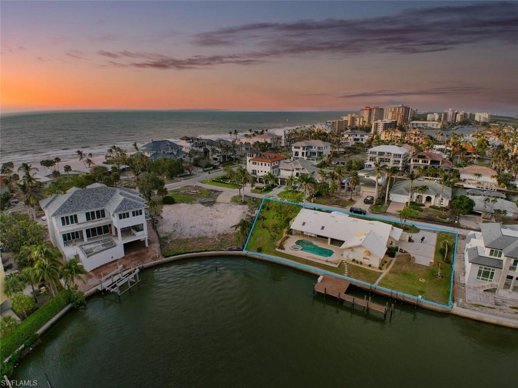 H8061 Presenting 128 Bayview Avenue. JUST RECEIVED COUNTY APPROVAL TO SUBDIVIDE. See Supplements for Zoning Verification Letter. 128 Bayview Avenue is arguably one of the most coveted and sought after properties anywhere in Naples. On a double lot (.52 acres) directly across the street from the beach with commanding southern exposure bay views and 154 ft. of frontage, this property is ready for the most discerning buyer to build his or her dream home, a family compound, or subdivide and sell. Dock your boat after a day on the water, grab a cocktail and your beach towel and walk across the street to the beach just in time for sunset. Proximity to The Mercato, The Ritz Carlton and the new Ritz Carlton Residences including beachfront and bay residences, a full service marina, waterfront promenade, park and cafe not to mention a new and updated La Playa, make this the only place to be as the center of gravity in Naples continues to move north. Pilings in place for a 4 motor boat lift. Dock replaced and seawall repaired in 2018. HOME SUSTAINED CONSIDERABLE DAMAGE during IAN and seller WILL NOT DO REPAIRS. Being sold "AS-IS". Please DO NOT WALK property. Agent accompany all showings.