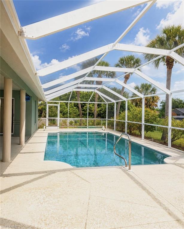 Move-in ready and priced to sell! This spacious 4-bedroom, 2-bath home features soaring vaulted ceilings, abundant natural light, and an open-concept layout that creates an inviting and airy feel throughout. Both the primary suite and a secondary bedroom offer direct access to the screened pool area, while the updated bathrooms feature modern finishes and walk-in showers. The generous living and dining spaces flow seamlessly into the kitchen, complete with breakfast bar seating and stainless steel appliances.Step outside to enjoy the oversized covered lanai, screened pool enclosure, and fully fenced backyard, providing plenty of space for entertaining, pets, and everyday enjoyment. Additional highlights include a new A/C system, paved driveway, tile flooring throughout, two-car garage, oversized lot, and mature landscaping. Conveniently located near shopping, dining, schools, parks, and major roadways. Don’t miss this opportunity to own a pool home at an attractive price point.