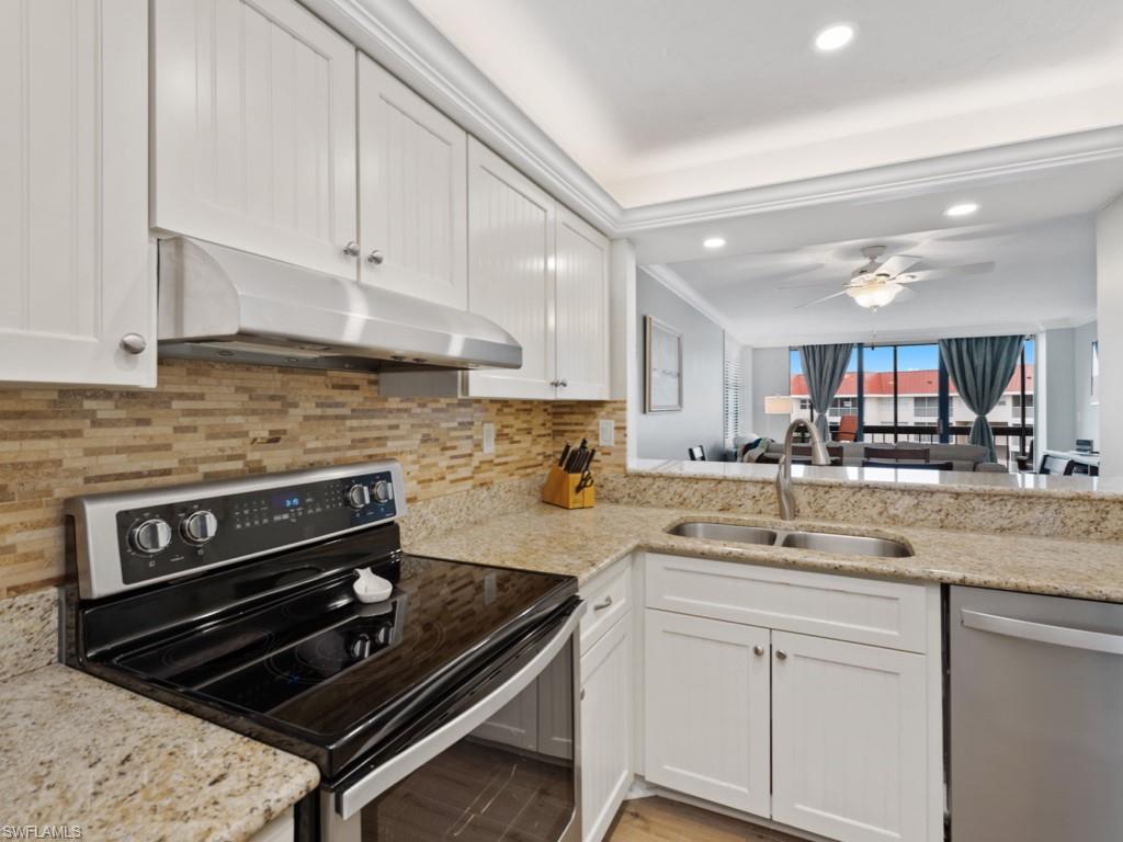 Gorgeous remodeled 6th floor end unit condominium with updated kitchen and baths, all with granite counters. The new flooring is wood look tile. Carport with storage! Four boat lifts are being installed and potentially 14 more lifts! The bathrooms floors & walls are Travertine. All new interior doors. 2014 A/C and newer hot water heater. 2017 stainless appliances plus a newer washer/dryer within the condo! The screened and very private wrap-around balcony has a beautiful side view of the bay and boat docks with an island view showcasing the sparkling lights at night. Very close to the pool, Chickee hut and boat docks. The private entrance to the beach is just across the street! South Seas is one of the few guarded gated communities. The heated condo pool has a great Chickee hut with charcoal and gas barbecue grills. Boat docks & kayak storage are available for rent at very reasonable rates. Clay tennis courts with new Pickle Ball courts! Bocce! Shuffleboard! Walking distance to restaurants and shops. South Seas has everything one could possibly want! Sale includes a separately deeded carport and storage locker valued at over $15K!