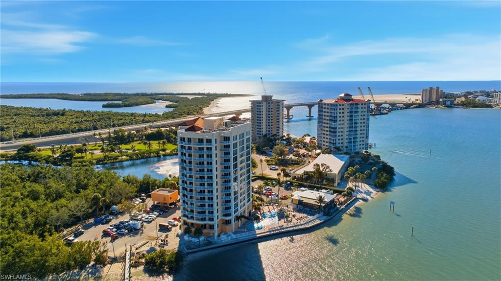 Welcome to your own waterfront vacation suite at Lovers Key Beach Resort, where every day feels like a getaway and every sunset feels like a private show. Perched on the 9th floor, this beautifully maintained one-bedroom, one-bath condo offers breathtaking Gulf and bay views, unforgettable sunset skies, and some of the best value in the building. From your oversized private balcony, enjoy daily dolphin sightings, passing boats, and panoramic waterfront scenery. Inside, the open-concept layout is designed for both relaxing and entertaining, featuring a fully equipped kitchen with granite countertops, abundant natural light, and floor-to-ceiling impact-resistant sliding glass doors that perfectly frame the coastal views. Offered completely turnkey, this is a rare opportunity to own a cash-flowing short-term rental with nightly rentals allowed, ideal as a personal beach retreat, investment property, or both. The on-site rental management program makes ownership easy and hassle-free, while strong rental potential adds exceptional flexibility and income opportunity. Even better, there are currently no special assessments, providing additional peace of mind for owners and investors alike. Lovers Key Beach Resort offers an impressive collection of resort-style amenities including a waterfront lagoon-style pool with cascading waterfall, spa, fitness center, owner storage, barbecue area, computer room, and on-site waterfront dining at Flippers on the Bay restaurant and bar. Perfectly positioned adjacent to Lovers Key State Park, you’ll enjoy immediate access to pristine beaches, kayaking, hiking trails, and Southwest Florida wildlife. Conveniently located just south of Fort Myers Beach with quick access to Bonita Springs, Naples, Sanibel, and Captiva, this is coastal resort living at its finest. Whether you’re searching for a waterfront escape, income-producing property, or both, this exceptional condo delivers the perfect combination of lifestyle, location, and investment potential.