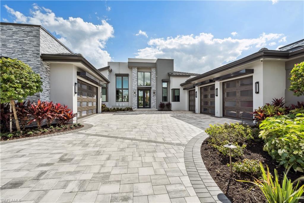 Your search for the perfect home and community is over. Your amazing lakefront home features an unimaginable combination of elegance, comfort and relaxation and it's waiting for you in the award winning community of Miromar Lakes. As you enter this breathtaking home, the first thing that captivates the senses is the abundance of natural light from the12' tall impact sliders. This home features 4,856 square feet of fabulous living space and contains five bedrooms, six baths, four fireplaces, a breathtaking cabana, huge den and room for 5 cars in the two climate controlled garages and a whole home generator. The open design with expansive wine room, natural gas stove, fabulous refrigerator and huge walk-in pantry along with four ovens makes this kitchen every chef's dream come true. When you're done playing on the lake or enjoying the award winning amenities at the clubhouse, unwind and relax by the pool in the evening and be enthralled by the glow of the stunning 12' fire pit. Make your dream home a reality today.