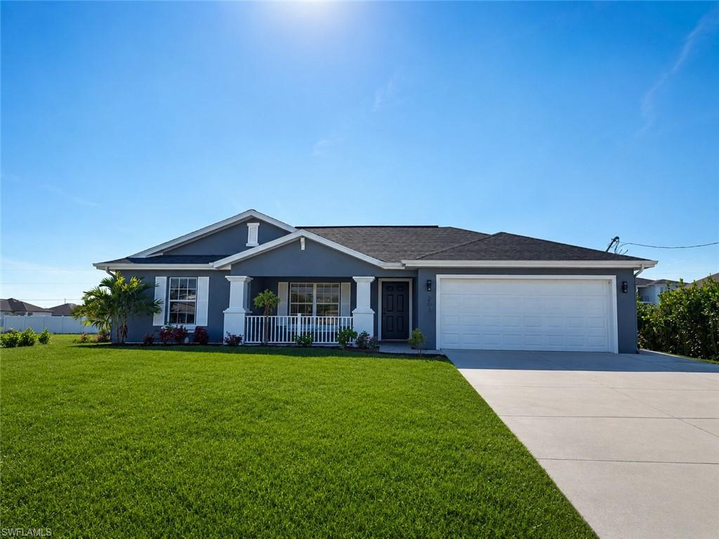 Welcome to 203 Chiquita Blvd S, a beautifully updated Cape Coral home with stylish finishes and an incredible outdoor living space. This move-in-ready property features a bright open layout, tile flooring throughout, updated lighting, and a refreshed coastal feel. The kitchen offers white shaker-style cabinetry, granite countertops, stainless steel appliances, tile backsplash, breakfast bar seating, and an easy flow into the dining and living areas.

The primary suite is spacious and inviting, with a beautifully updated bathroom featuring a new vanity, black fixtures, walk-in shower with glass enclosure, rainfall shower, and modern tile accents. The home also offers comfortable guest bedrooms and a clean, neutral design throughout. 

Step outside to a private fenced backyard built for entertaining, featuring an expansive paver patio, covered seating area, outdoor kitchen/grill space, and plenty of room to relax or host guests. Conveniently located near shopping, dining, parks, schools, and major Cape Coral roadways, this home is a great fit for a primary residence, seasonal home, or investment property. The garage has been converted into a storage or workshop area equipped with a utility sink. Schedule your private showing today! Home has been virtually staged