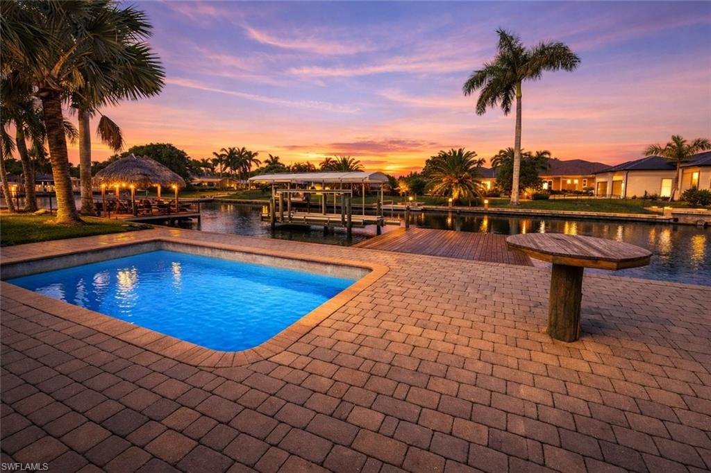 DIRECT GULF ACCESS OVERSIZED LOT with 10,000 lb dock and lift already in place! Save on impact fees and start building your dream home today in the highly desirable Yacht Club. Intersecting canal views and a short boat ride out to open water. Conveniently located within a short bike or car ride to all things new and happening in downtown Cape Coral!