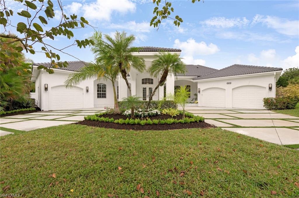 Masterful presence with unexpected details where the ordinary is reimagined to be truly extraordinary. Located in the much sought after Pine Ridge Estates and nestled in over an acre of lush tropical landscaping, this newly renovated 5 bedroom/ 5.5 bath estate pool home defines elegance and sophistication. The distinctive exterior is complemented by an elegant porte-cochere and gracious entrance. The meticulous custom details throughout translate into graceful and elegant interiors.  Lofty ceilings, panoramic views and spacious interiors have been designed for luxury living and to embrace the beauty of the Naples lifestyle. This home defines luxury from the chef’s kitchen with Wolf and Miele appliances, to lighting fixtures and sophisticated materials.  An exquisite tropical landscaping enhanced by an expansive koi pond and water features connected by a picturesque bridge surround the gracious outdoor living space that features a custom heated pool and spa. A unique home that offers resort style luxury living for those that expect more!