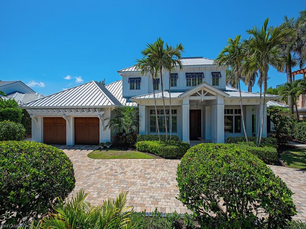 The timeless charm of an Old Florida cottage, but built solid for longevity, this 2014 Grand Bay home—designed by the acclaimed Weber Design Group—captures the essence of coastal living. Beautiful trim work, subtle contrasts, and a very comfortable layout create a home that feels freshly completed. That “new-home” feel is no illusion: concrete block construction, impact-resistant glass, a standing seam metal roof, and motorized rear shutters are all seamlessly integrated, while consistent, meticulous maintenance ensured enduring quality. Ideally situated just off Central Avenue in the very heart of Old Naples, on a full size 100 x 150 southern exposure site, this home is very conveniently located to the fine dining and shopping of 5th Avenue South, 3rd Street South, and just 2 blocks from the Gulf of America. Whether it’s shopping, dining, or sunsets on the beach, everything is within easy reach. With these attributes, the location remains serenely quiet, day and night. This is coastal living at its most refined: beautifully built, perfectly located, and designed for everyday elegance.