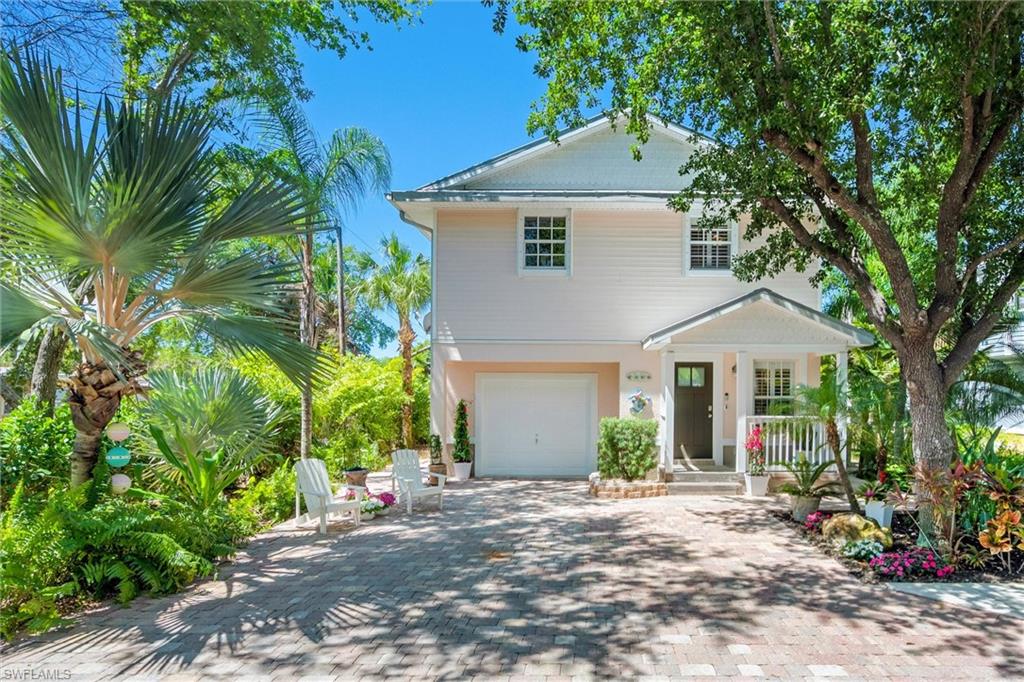 This bright and cheerful 3-bedroom, 2-bathroom furnished Key West style bungalow exudes coastal charm and sits on a quiet, private street near Naples Bay in the highly sought-after Bayshore Arts District. The renovated kitchen features custom cabinetry, quartz countertops, a prep-sink area, decorative backsplash, and stainless steel appliances. Upstairs boasts vaulted ceilings and polished solid teak hardwood floors. Enjoy brand-new bathrooms, including a main-level primary suite with a spa-like shower and freestanding tub. Freshly painted inside and out, the home is filled with natural light from east and west exposures and is surrounded by lush landscaping. HOA fees cover professional management, landscaping, irrigation, tree trimming, sidewalks, and road maintenance. Additional amenities include a one-car garage plus two assigned guest parking spaces. Just under 2 miles to Naples’ iconic 5th Avenue and nearby sugar-white beaches. Bike or walk to Celebration Food Truck Park, Ankrolab Brewery, Starbucks, Naples Botanical Garden, Bayview Park, East Naples Community Park, US Pickleball Championship courts, and Sugden Park. Situated in one of Naples’ most vibrant and rapidly improving neighborhoods, this property is an excellent investment opportunity or full time residence. This property did NOT flood in any prior hurricanes.