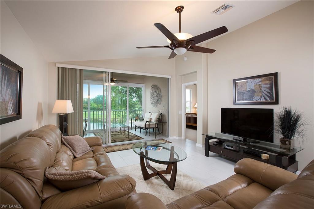Enjoy a mile-wide view from this spectacular turn-key furnished Orchid end residence! Shows like a model and the owners have taken impeccable care of the two-bedroom-plus-den, two-bath open plan. Features and new upgrades include hurricane glass-enclosed lanai (2016), making this space enjoyable year-round. New hot water heater, 2013 new carpet and linen coastal tile installed and carried through the lanai, all new appliances in 2015, new master bathroom shower and tile detail, decorator light and fan fixtures, custom master bedroom closet and more. Convenient location only moments away from the neighborhood community pool. Spring Run is a bundled golf community and all owners are members of all the lifestyle activities. Recently renovated clubhouse, Gordon Lewis 18-hole golf course, four Har-Tru® tennis courts, heated community pool and spa, bocce ball courts, grill and bar, pro-shop, fitness, library and the option of joining the Commons Club private beach membership, fitness and spa with personal trainers available, The Rookery restaurant, short drive to the airport and Coconut Point Mall for dining and shopping. Spring Run is in the perfect central, quiet location.