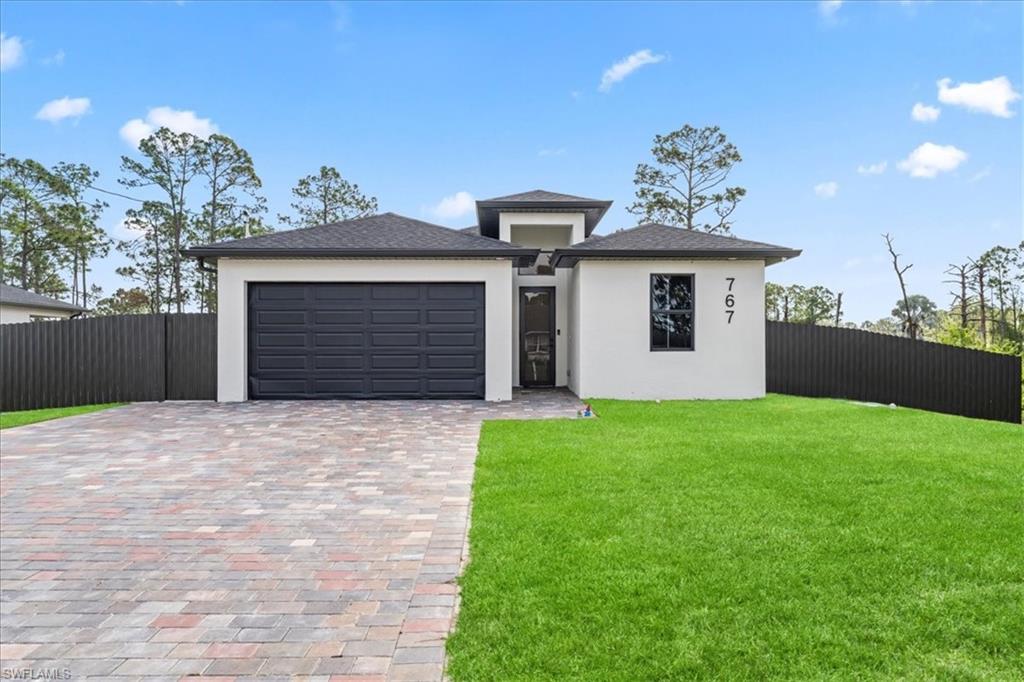 Modern 3-Bedroom Home in One of Lehigh Acres' Fastest-Growing Areas

Welcome to this beautifully maintained 3-bedroom, 2-bathroom home, ideally located just minutes from State Road 82, offering convenient access to Fort Myers, Southwest Florida International Airport, and the exciting new commercial developments transforming the area. This rapidly growing corridor continues to attract new shopping, dining, and business opportunities, making it a great place to call home.

Designed for both comfort and functionality, this home features a reverse osmosis water filtration system, high-end stainless steel appliances, and a security camera system for added peace of mind. The fully fenced backyard provides exceptional privacy and includes a charming custom dog house, perfect for your four-legged family members.

Outside, you'll find an oversized driveway with plenty of room for multiple vehicles, a spacious sidewalk, and an automatic irrigation system that keeps the landscaping looking its best year-round. Whether you're relaxing at home or entertaining guests, this property offers the perfect blend of convenience, comfort, and outdoor living.

Don't miss the opportunity to own a home in one of Southwest Florida's fastest-growing communities, where modern living meets outstanding value.