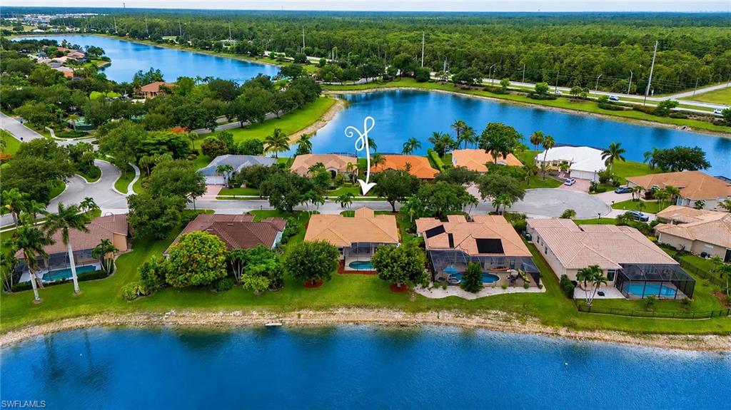 Long Lake Views! NEW 2018 ROOF! ELECTRICAL STORM SHUTTERS! Cul-De-Saq located, beautifully updated POOL home situated on an oversized  lakefront lot in the highly sought-after community of Waterways of Naples. Offering approximately 3,000 square ft of living space, including the expansive screened lanai, this residence combines comfort, style, and exceptional outdoor living. Designed for both everyday living and entertaining, the home features formal living and dining rooms, a spacious family room with sliding doors to the lanai, an updated kitchen with granite countertops, stainless steel appliances, abundant cabinetry, sunny breakfast area overlooking the pool, lake, and fountain. The spacious primary suite offers a large walk-in closet, updated bath with dual vanities, oversized shower.
Step outside to your private backyard oasis featuring pool, expansive paver lanai, mature landscaping, and a large yard with spectacular long-lake and fountain views.
Buy with confidence knowing the major updates have already been completed, including a new roof (2018), that adds a long term value and security, motorized and retractable hurricane shutters (2020), pool cage (2019), luxury vinyl flooring (2020), A/C, water heater, newer kitchen appliances, newer interior and exterior paint.  Elegant 10-inch crown moldings add architectural charm. A-rated school district, with private community pedestrian gates providing convenient direct walking access to both nearby elementary and middle schools. Walk to schools, no need to drive! Residents of Waterways enjoy outstanding amenities, including a clubhouse, resort-style pool, fitness center, tennis, pickleball, basketball, playground, and private boat and RV storage.