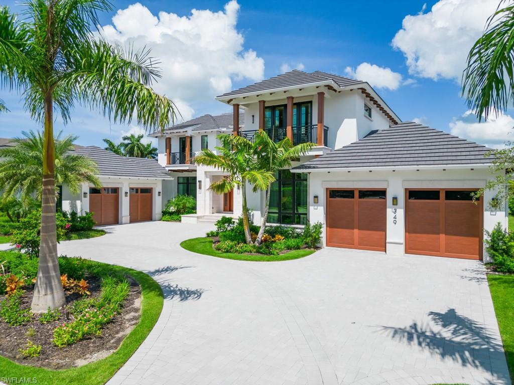 Bay Colony new construction! Introducing a magnificent estate by Stock Custom Homes situated on one of the most prime west-facing lakefront lots in Bay Colony Shores. Expertly designed by premier Naples architecture firm Stofft Cooney Architecture with acute attention to every timeless detail and feature. Comprising over 7,700 square feet of designer interior living space with five bedrooms, six full baths and two half baths masterfully transformed by renowned design firm Beasley & Henley Interior Design. Upgraded features include wide-plank wood flooring throughout, wine room, custom fireplace wall, an unparalleled open chef's kitchen including double island, quartz countertops, designer Sub-Zero refrigeration, Wolf 48-inch sealed six-burner range top, Wolf double wall oven, convection oven, warming drawer, home automation and lighting control. Saltwater pool with spa, sun shelf, fire/water bowls and a seating area with a fire pit. Enjoy the ultimate Naples lifestyle in Bay Colony.