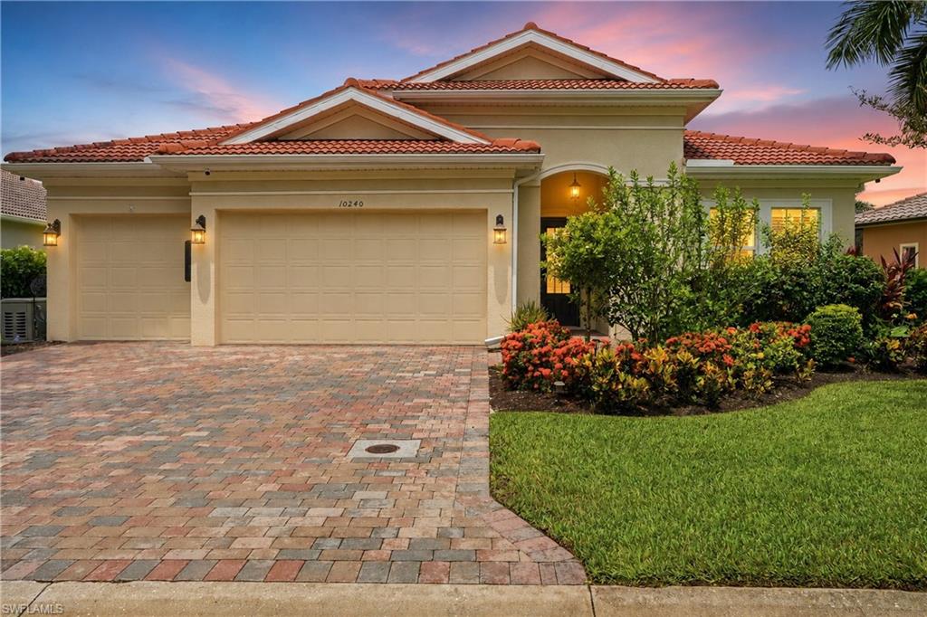 Immaculate. Private. Highly-Upgraded. Welcome to 10240 Avonleigh Drive, the newest-built home in the peaceful and coveted community of Fairwinds. Built in 2019 and beautifully enhanced with approximately $300,000 in improvements, this move-in-ready residence offers over 3000 sq ft. under air, 3 bedrooms plus a den, 3 full baths, 2 half baths, a 3-car garage, and spectacular western water views designed for unforgettable sunsets.

Inside, the home feels refined, bright, and effortlessly livable with impact glass windows and doors, high ceilings, double crown molding, wide-plank flooring, plantation shutters, custom mirror wall coverings, and new bedroom carpeting. The kitchen features cream cabinetry, granite countertops, a warm taupe tile backsplash, updated appliances including a Miele dishwasher, a walk-in pantry with custom wood shelving, and a spacious dining area overlooking the water. Throughout the home, thoughtful custom upgrades include eight built-in cabinetry features with quartz tops, including a bar, china cabinet, window seats with storage, and additional built-ins across multiple living spaces.

The den is a standout, designed with custom cabinetry, built-in desks, custom glass tops, and unique glass flooring detail, creating a polished and functional workspace. The primary suite offers comfort and accessibility with custom walk-in closet built-ins, upgraded flooring, and a handicapped-accessible shower. The laundry room has also been upgraded with custom storage cabinetry, a stainless sink, and an Electrolux washer.

Outdoor living is just as impressive. The original lanai was enclosed in 2021 with impact windows and doors, automatic blinds, and a separate mini-split AC system, creating a comfortable year-round sunroom. A new lanai was added in 2024 with French doors and automatic awnings, expanding the home’s indoor-outdoor living experience. Additional features include a whole-house Kohler generator with switching panel, an owned 500-gallon propane tank with remote gauge, whole-house Kinetico water filtration, a Tesla charger, mini-split AC in the garage, large hanging garage storage racks, added attic storage, enhanced electrical outlets throughout, ceiling fans in all main rooms, automatic front porch mesh roll down closure, and extensive upgraded landscaping with flowering plants, bushes, and trees.

Fairwinds offers low HOA fees that include landscaping and irrigation through a community well, along with a quiet, private setting in an exceptional Bonita Springs location. Enjoy easy access to Imperial Parkway, US-41, and I-75, with Coconut Point, The Promenade, beaches, Downtown Historic Bonita Springs, Riverside Park, Shangri-La Springs, Wonder Gardens, local restaurants, cafés, shops, live music, and the new food truck park all just minutes away. A rare opportunity to own a newer, highly upgraded, sunset-view home in one of Bonita Springs’ most peaceful communities.
