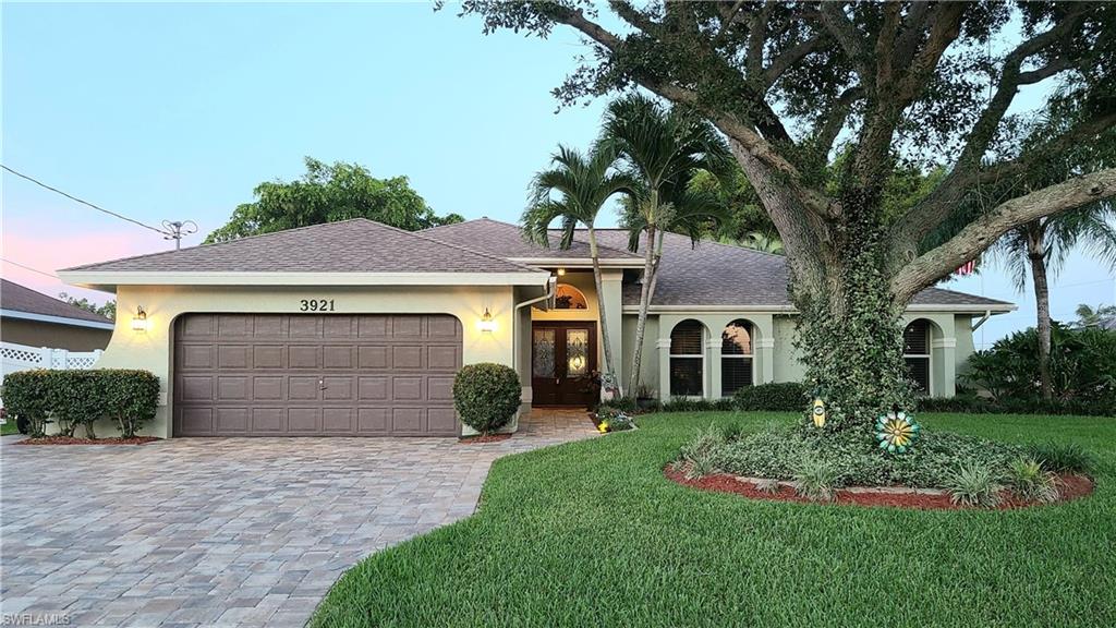 Welcome home! This 3 bedroom plus Den home has everything you need! Located in the Oasis Boulevard area on a corner lot, this meticulously maintained pool home has tile through out with an open floor plan that is great for every day living or entertaining. Interior features include an extra wide pavered driveway, double front door with wood detailed ceiling on the front entry and Plantation Shutters on the windows. The Den features built in shelving and cabinets. The Kitchen has stainless appliances, granite counter tops and upgraded tile back-splash. Exterior features included pavers around the pool and spa, built in outdoor kitchen, extended lanai with fire place and vinyl fenced yard. Other upgrades are new A/C in 2019, Pool resurfaced, 2017 and assessments paid in full! 
Call and schedule your private showing today!