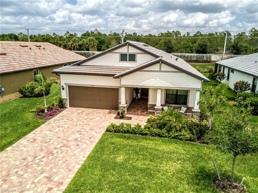 MOTIVATED SELLERS!  Make offer!  Gorgeous 3 Bedroom + 2 Bath home with added Sun Room, saltwater pool and oversized spa, and top tier upgrades! Truly be one of a kind as this is the only home in the neighborhood with this exact model, elevation, and paint color. From the moment you enter through the doorway you will feel like you are walking in to a model home. Best of all, this model is known for letting in the most natural sunlight of any Pulte home! Custom level 6 countertops and tile throughout the home offers an uncompromising luxurious feel. Extended garage and finished attic provides spacious additional storage options. Florida living doesn't get much better than this! Corkscrew Shores features "World Class Amenities" highlighted by the pristine 240-acre lake. Resort style pool and spa, outdoor bar and restaurant, kayak & canoe launch, fishing pier, fire pit, massage therapy room, conference room, movement studio, fitness center, tennis center with 5 Har-Tru tennis courts, bocce and pickleball courts, playground and picnic pavilion, sports field and walking trails! Seller will offer $1,000 credit at closing!