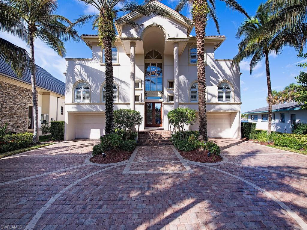 Impressive 5 bedroom/6.5 bath home with direct gulf access! Residence is located Directly on Naples Bay with panoramic views of the water and Tin City. A few of this home’s outstanding features are its open floor plan with marble and woods floors, gourmet kitchen, large master suite with dual master closets/baths, fully equipped home gym, 8-car garage, infinity pool and spa, and 2 large docks each with a boat lift. Boat lift capacity is an incredible 50,000 lbs and 13,000 lbs respectively! All of the lower and upper floors are high quality poured concrete to ensure sound insulation on every level.