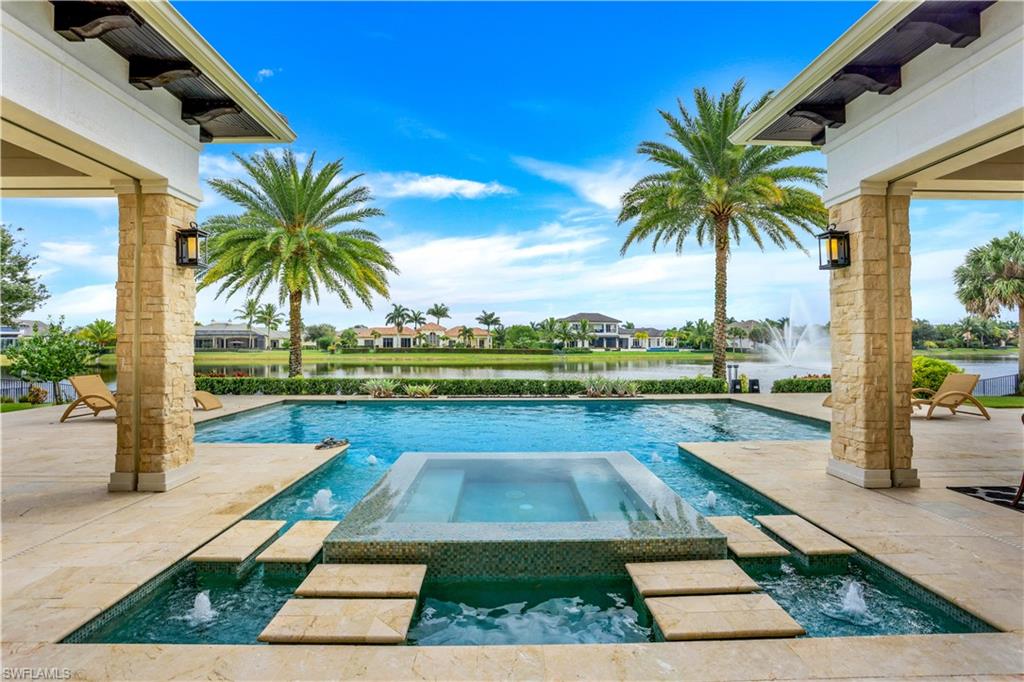 This sprawling custom estate in Quail West sits on an oversized 180’ x 200’ lot with expansive lake views. From 19’ vaulted ceilings to the well-appointed en suite bedrooms, this residence offers exceptional quality, materials, finishes & sophisticated design. The chef's kitchen is bright with an oversized center island, custom cabinetry and Wolf / Sub-Zero appliances. A spectacular master suite features 14-ft ceiling, a large sitting area, spa like master bath and 2 large walk-in closets with custom cabinetry. Floor-to-ceiling sliders in the great room opens to an equally impressive outdoor living area with T&G covered lanai, several entertaining areas, resort style pool/spa, outdoor kitchen, outdoor dining, fireplace & fire pit overlooking the lake. Additional features: spacious office, exquisite formal dining, wood floors, impressive ceiling details throughout, 4-car garage, security system, storm shutters & mosquito misting system. The lush grounds and amenities of Quail West have made it one of the most sought after communities in Southwest Florida, offering 36-holes of equity golf, 70,000 SF clubhouse, tennis, fitness, spa. This home is being sold fully furnished.