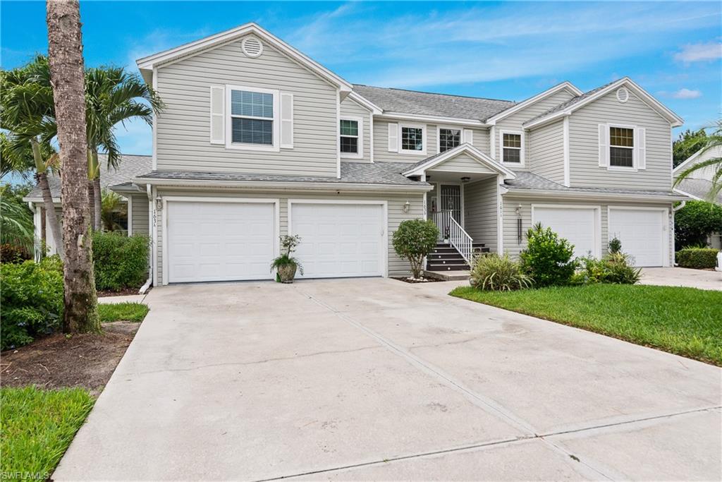Move in ready condo plus A private GARAGE!!  Includes EXTRA STORAGE ROOM  for bicycles/ beach chairs . decorations , etc. ALSO AN EXTRA  long driveway for 2 plus  cars, AND  ample guest parking . This  lovely end unit receives a lot  of natural light through the  hurricane IMPACT windows. A brand  NEW  (2026) AC UNIT  that is under warranty for 10 years. Updated baths and kitchen with a water purifier, custom pantry and  a brand new dishwasher . Inside large laundry machines along with a new washing machine too! Across the street from  the heated community pool/clubhouse and only steps to the Kings Lake  community one mile walking /exercise path and the  tennis and pickleball court. Pet friendly with no dog weight limit. Dog walking paths are abundant ! This home is conveniently within a walking/biking  location to everyday shopping in the Kings Lake center.  The location is only a  straight few miles onto 5th Ave restaurants and the beach! Rentals are 30 day minimum 12 times a year making for an EXCELLENT investment or year round residence. Just pay 2 bills a month, one to the HOA  which covers all but  electric your second monthly bill, this makes it easy for bookkeeping!! Again, includes a brand  new AC  and Hurricane impact windows ! A larger garage with storage room at this price point  is incredibly valuable.