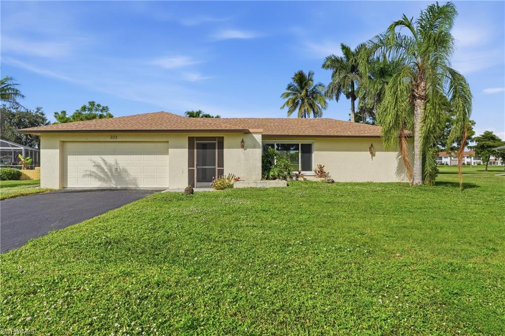 One or more photo(s) has been virtually staged, AI generated or rendered.  AGGRESSIVE NEW PRICE – PRICED TO SELL! St. Andrews at Lely Golf Estates – A Home with Heart, Ready for Your Special Touch! Welcome to this inviting single-family home in the friendly and beautifully maintained St. Andrews at Lely Golf Estates community. Nestled among peaceful golf views, this lovely 3-bedroom plus den, 2-bath home has already received over $100,000 in thoughtful updates, including a new electrical panel, garage door opening and is now waiting for its new owners to bring their personal touch and a little TLC to make it truly shine. You’ll love the warm, open layout that offers both comfort and functionality. The split-bedroom design provides privacy for family or guests, while the bamboo wood floors add a touch of natural elegance to the main living spaces. The kitchen has been beautifully updated with custom wood cabinets, Level 5 granite countertops, and stainless steel appliances, making it a perfect gathering spot for preparing meals or entertaining loved ones. The spacious master suite features his-and-hers walk-in closets and a beautifully updated bathroom with dual granite sinks and a glass walk-in shower. Light pours into the home through a custom skylight and impact-rated double-pane windows, creating a bright, airy atmosphere that feels welcoming all year long. Step outside to your screened lanai and take in the peaceful long lake views and the 4th fairway of Hibiscus Golf Course—a serene setting to enjoy your morning coffee, read a book, or simply watch the sunset. There’s even room to add your own pool if you wish! Located on a quiet, friendly street, this home offers easy access to Downtown Old Naples, pristine beaches, great schools, shopping, dining, churches, and medical facilities. Whether you’re looking to settle into retirement or find a wonderful place to grow and make memories with family, this home offers the best of Naples living. A one-year home warranty adds extra peace of mind, so you can focus on what really matters—making this home your own. Come see the possibilities and experience the warmth of St. Andrews at Lely Golf Estates—a home where comfort meets potential and where your next chapter is waiting to begin.