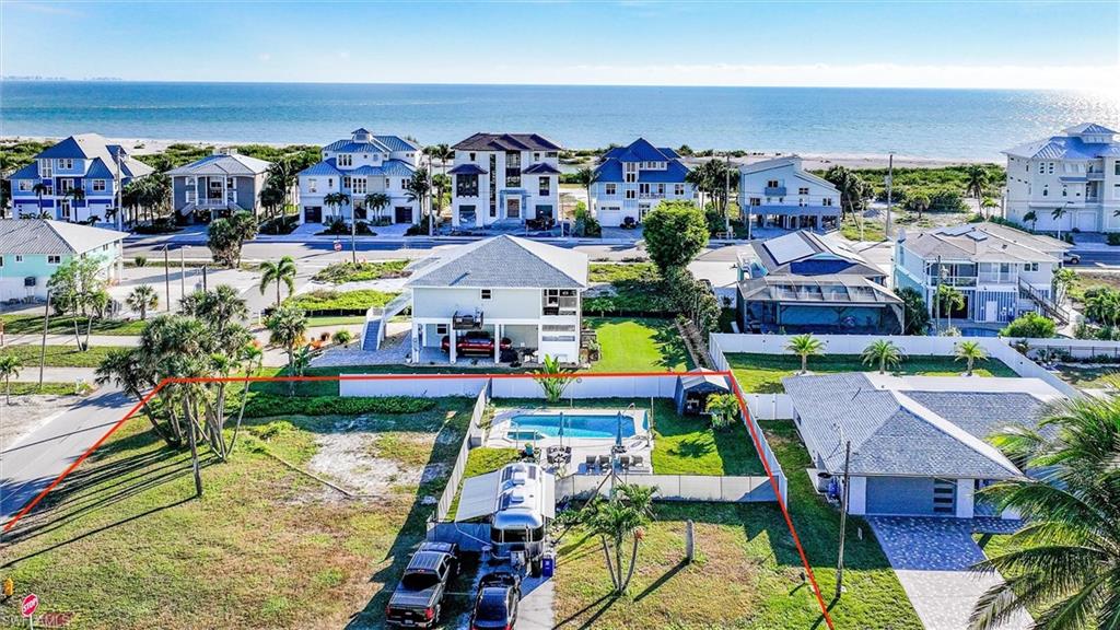 An other Price improvement with pool included!!!!!
Prime Corner Lot with Approved Plans & Deeded Beach Access – Ready to Build (plans optional) 
Rare opportunity to own a large corner lot on the south end of Fort Myers Beach, just minutes from the beach with deeded beach access. This ¼-acre property is fully prepared for construction and offers the potential to build a substantial custom home in a neighborhood experiencing extensive new construction and renovations.
The property features a nice-sized pool and spa in working order, along with an irrigation well already installed. The seller had planned to build and has completed nearly the entire permitting process — allowing the next owner to save 6–9 months of time. 
FMB-approved architectural plans custom-designed for this lot are available for $25,000, and permit fees have already been paid. Simply bring your builder, pick up the permit, and start building.
Completed & Paid Items Include:
Custom two-story 4 BR / 4.5 BA architectural plans – $12,600
Florida Department of Environmental Protection permit – $750
Architectural engineering – $1,200
Environmental study – $750
Geotechnical test for piling depth – $3,875
Permit & impact fees – $5,600
Initial survey – $550
Civil engineering – $2,000
Fence installed on property line – $10,000
Additional Highlights:
Corner lot offering flexibility and design options
Deeded beach access
Pool & spa operational- New pool equipment and heater 
Irrigation well in place
Many new homes and renovations nearby
Easy access to Bonita Springs and Naples
Please inquire for details regarding buildable options and zoning allowances for this property.