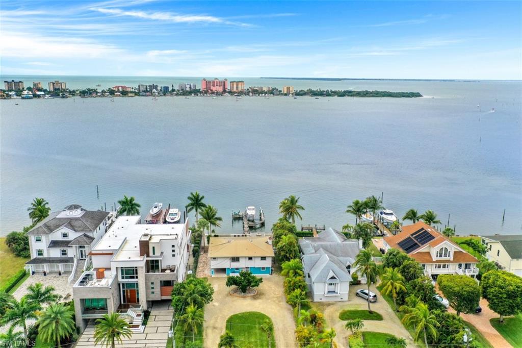 Direct Bayfront Vacation Rental Home with newer seawall, boat dock w/16,000# lift, direct gulf access.  Home has been recently painted inside and out, with bathroom remodeling and new flooring in great room and kitchen. 
One of the few 75 foot wide lots on the bay. Lots of new homes on the bay.