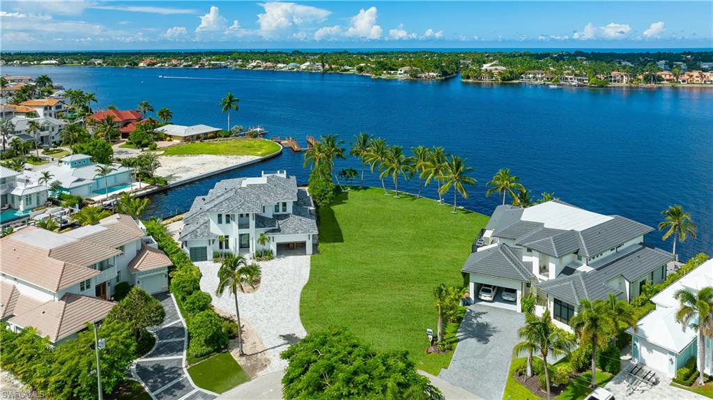 Incredible opportunity to design and build your dream home with panoramic views of Naples Bay! This rarely available bay front lot provides some of the most dramatic western views that Royal Harbor has to offer and boasts 157 feet of water frontage providing direct access to the Gulf of Mexico with no bridges. Price is reflective of lot value only as current home is not inhabitable. The desirable boating community of Royal Harbor is ideally located just minutes from 5th Ave., South and 3rd Street South's downtown shopping, entertainment, fine dining and white sand beaches.